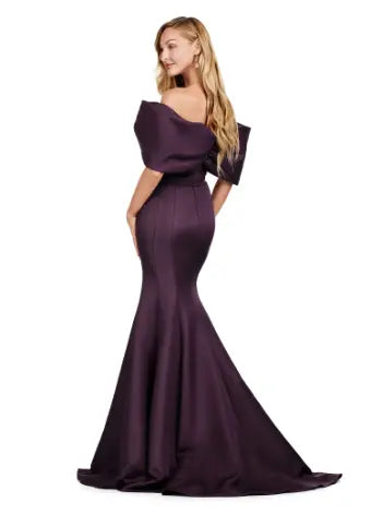 Experience elegance with the Ashley Lauren 11413 Long Prom Dress. Designed with an off-shoulder neckline, this dress is crafted from luxurious double-faced satin and features an oversized bow for added drama. Perfect for formal events and pageants, this dress will make you stand out with its sophisticated and flattering silhouette. Talk about elegant. This off shoulder gown is complete with an oversized bow along the neckline. This double faceted satin gown has a mermaid silhouette.