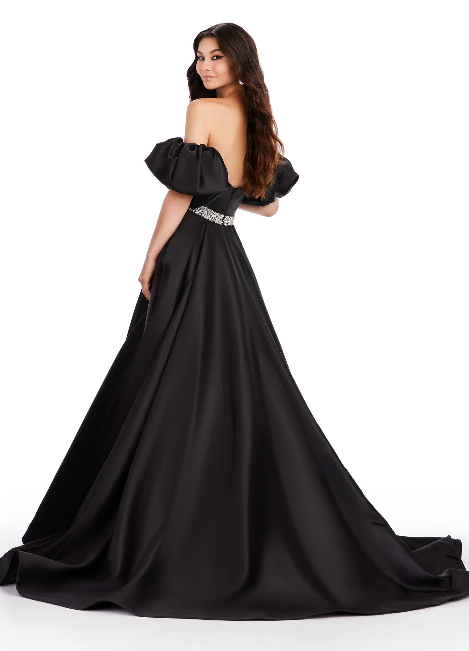 Elevate your formal look with the Ashley Lauren 11543 Long Prom Dress. The off-shoulder, puff sleeve design exudes elegance while the Mikado ball gown silhouette adds drama. Perfect for proms, pageants, and other formal occasions. his classic strapless Mikado ball gown features a beaded waist band. The look is complete with detachable puff sleeves.