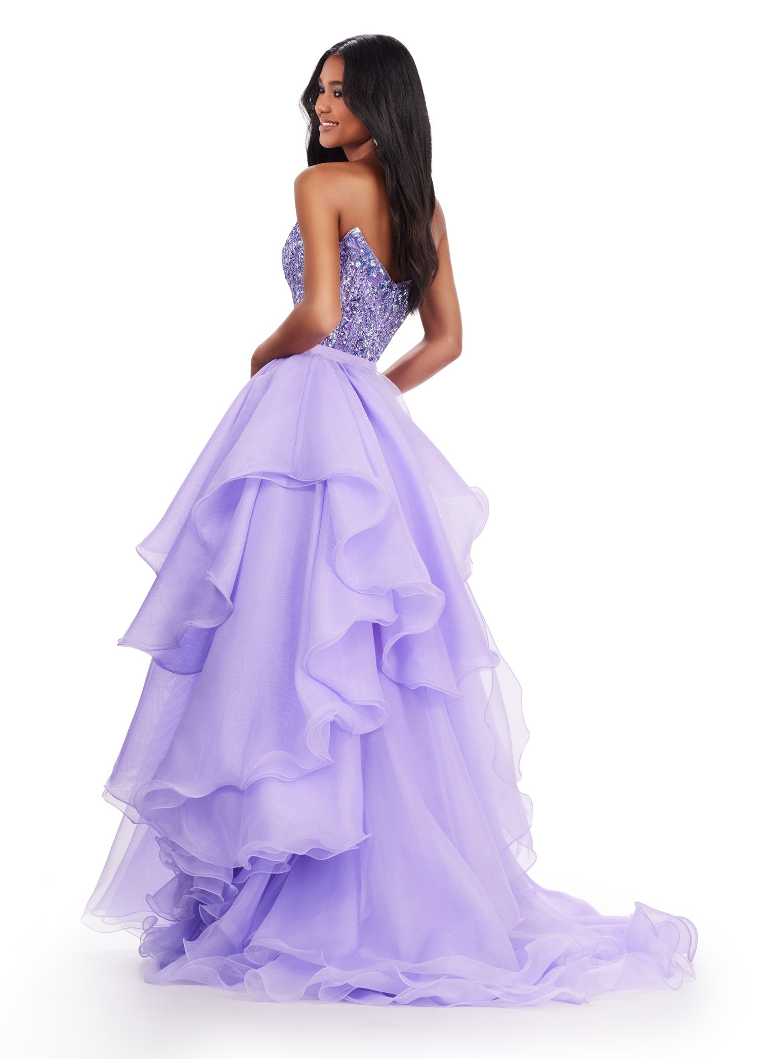 Get ready to make a statement at your next formal event with the Ashley Lauren 11601 Long Prom Dress. This elegant gown features a stunning organza ruffle side overskirt with a daring slit, perfect for showing off your legs. Complete with a formal pageant-worthy design, you'll be sure to turn heads all night long. An overskirt that is here to slay! This fabulous ruffle organza side overskirt is sure to look incredible with your next look. Pair it with your favorite ASHLEYlauren dress, jumpsuit or cocktail.