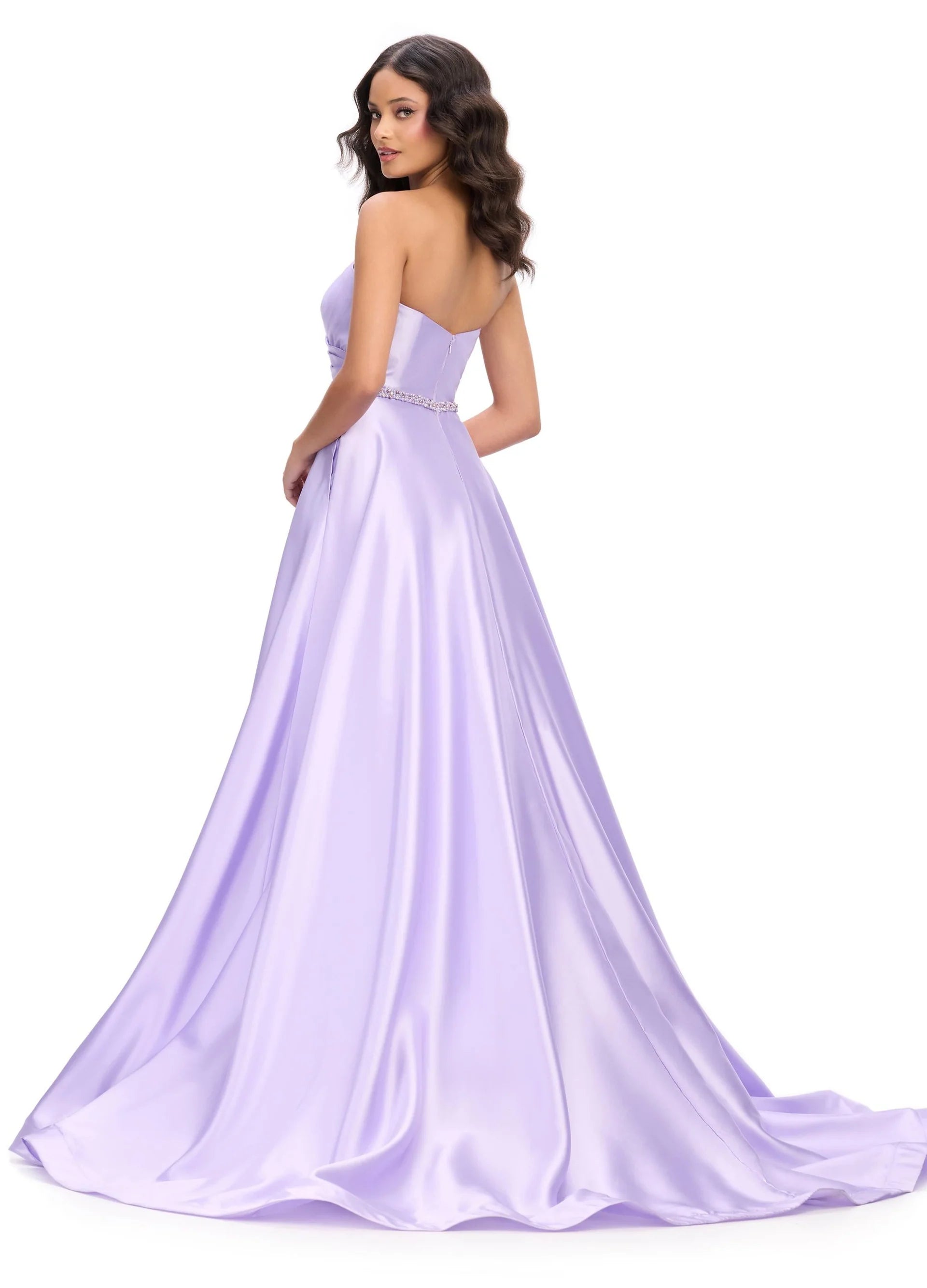 Elegant and sophisticated, the Ashley Lauren 11773 Strapless Ballgown is perfect for any formal occasion. The ruched bodice and crystal belt add subtle details, while the strapless design allows for comfortable wear. Made with high quality materials, this dress is sure to make a statement.