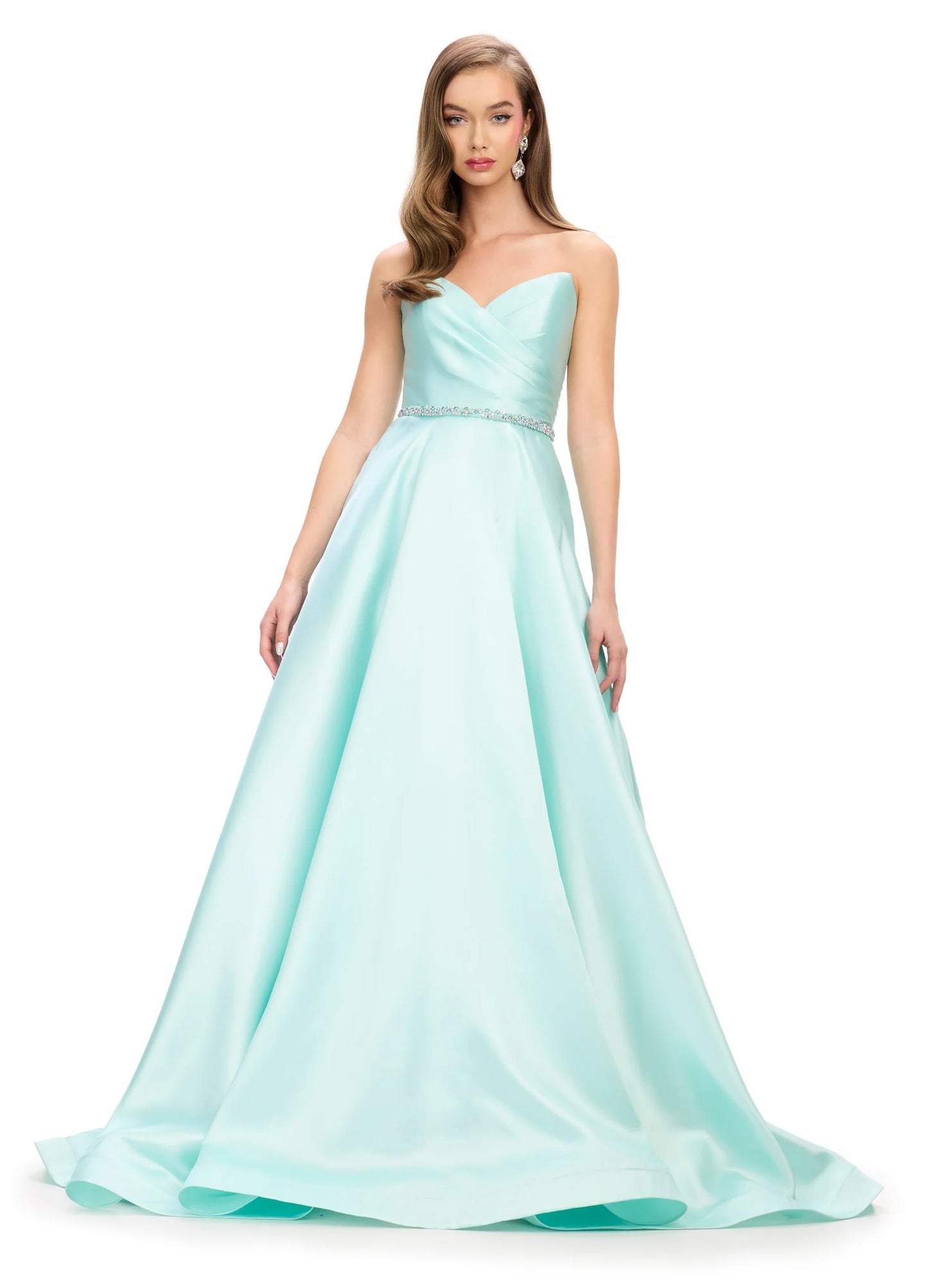 Elegant and sophisticated, the Ashley Lauren 11773 Strapless Ballgown is perfect for any formal occasion. The ruched bodice and crystal belt add subtle details, while the strapless design allows for comfortable wear. Made with high quality materials, this dress is sure to make a statement.