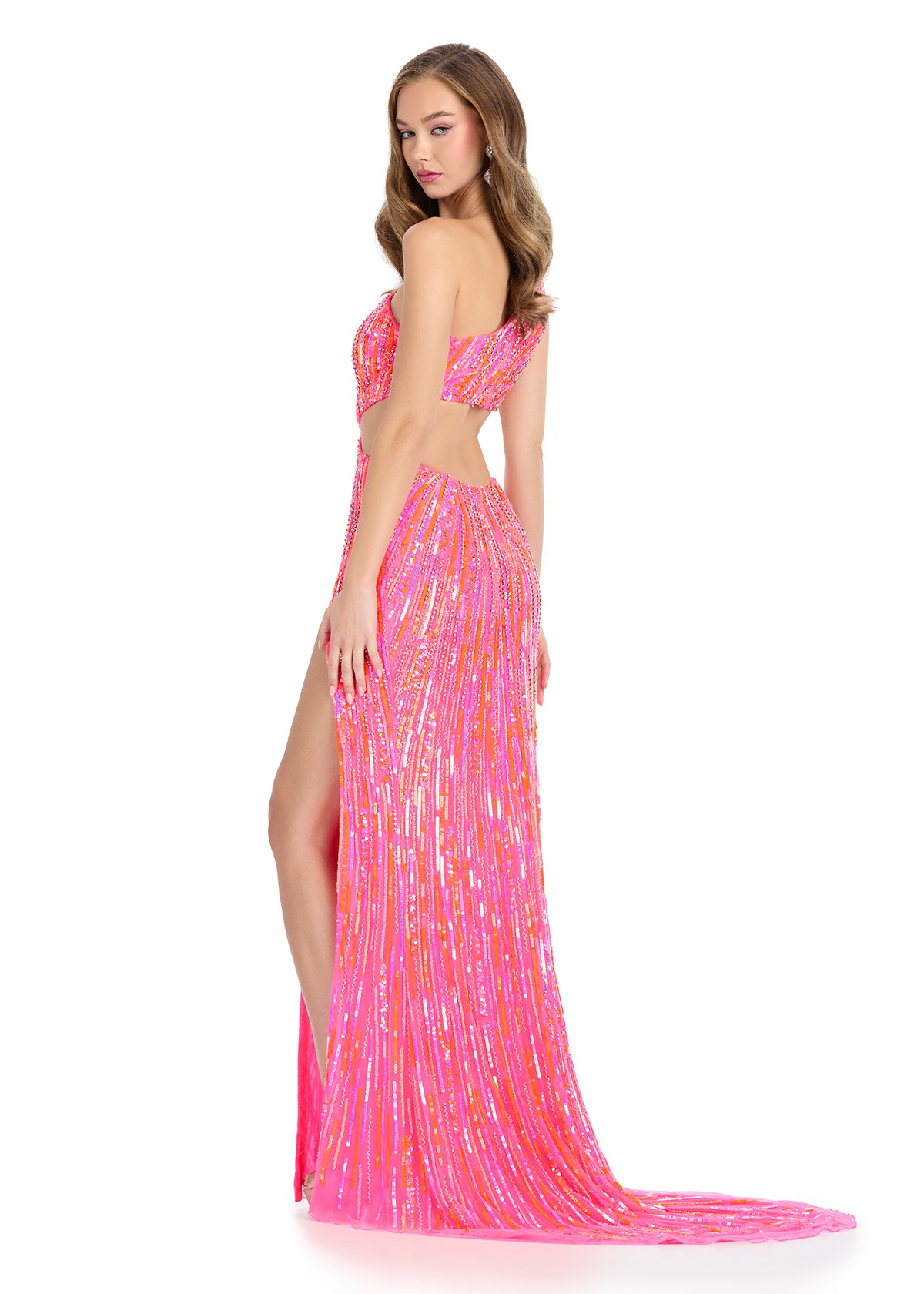 Get ready to sparkle and turn heads in the Ashley Lauren 11789 Sequin One Shoulder Prom Dress. With a dazzling sequin design and a flattering cut out detail, this formal gown is perfect for any special event. The one shoulder neckline adds a touch of elegance, while the thigh-high slit adds a hint of drama. Look and feel your best in this stunning evening gown.&nbsp;Be ready to turn heads with this fully beaded gown, featuring a slit with chic cut out sides and open back that exude confidence. With its eleg