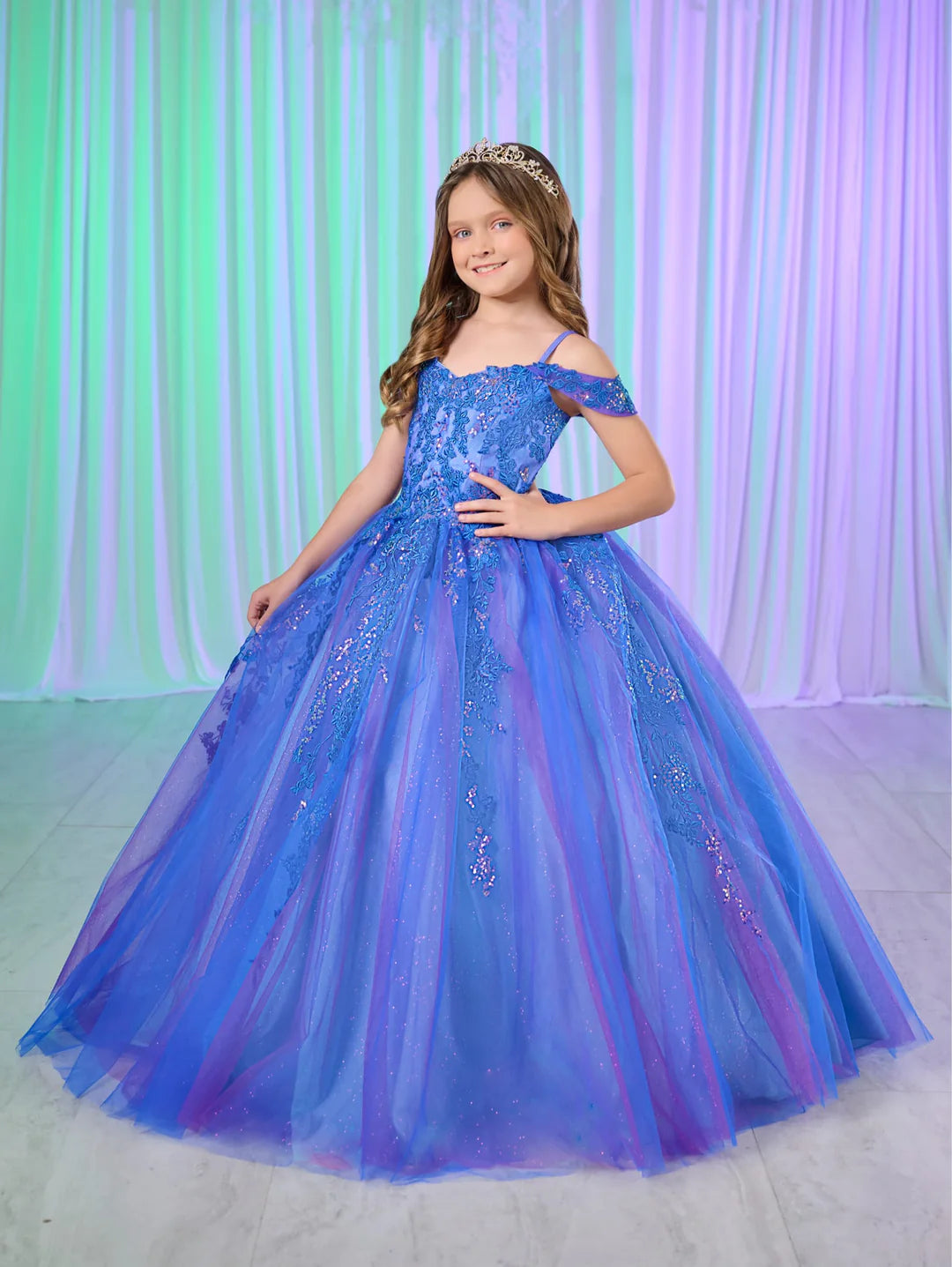 Expertly crafted with shimmering lace and delicate tulle, the Tiffany Princess 13760 dress is the perfect choice for any pageant occasion. The off the shoulder design and corset back add a touch of elegance, while the flowing tulle skirt adds a sense of movement. Make a statement with this stunning dress.