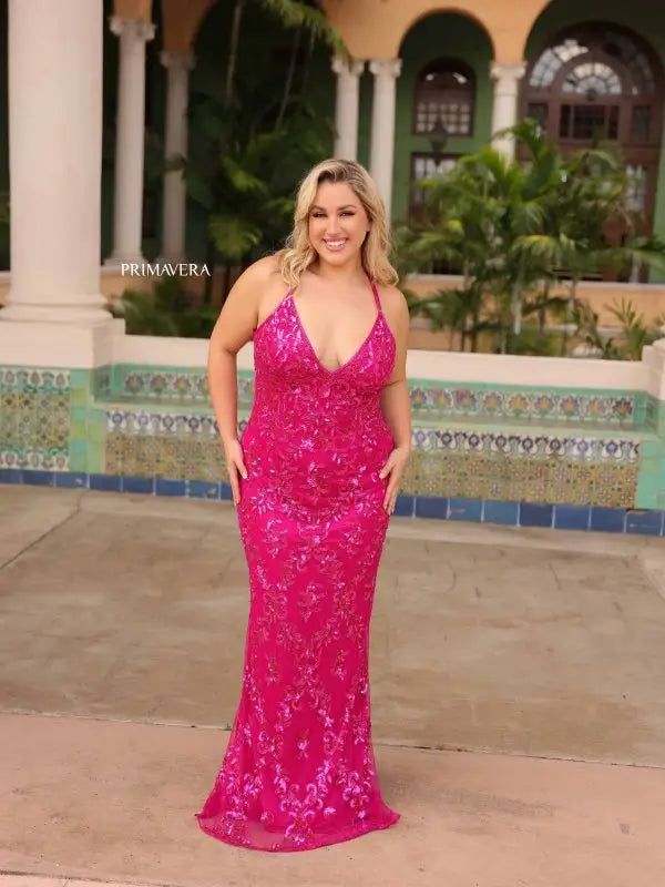 Elevate elegance with this Primavera Couture 14043 Long Prom Dress. Dazzling sequins, a fitted design, and criss-cross detailing accentuate your curves and add a touch of sparkle. The v-neckline elongates the neckline, making this gown perfect for formal events. Stand out from the crowd with this plus size beauty.