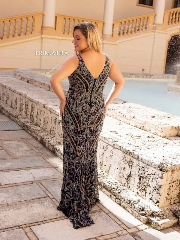 Elevate your evening gown game with the stunning Primavera Couture 14053. This long prom dress features a flattering V-neckline, figure-hugging sequin design, and a fitted silhouette for a glamorous and sophisticated look. Perfect for any formal event, this plus size gown will make you feel confident and beautiful.