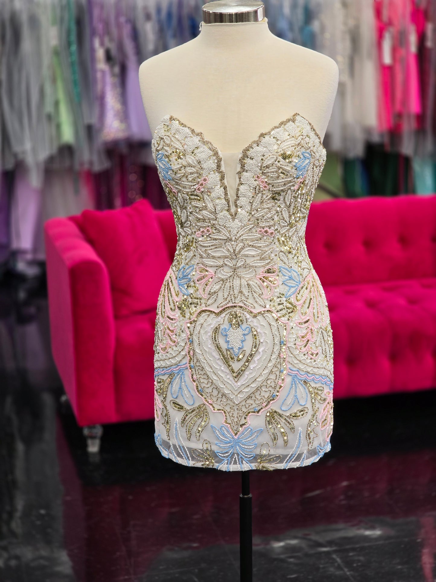 Look gorgeous in the Primavera Couture 4243 Beaded Homecoming Dress. Featuring a corset strapless gown with a v neck sweetheart neckline, this dress is perfect for any special occasion. The intricate beading adds a touch of elegance and the corset design ensures a flattering fit.