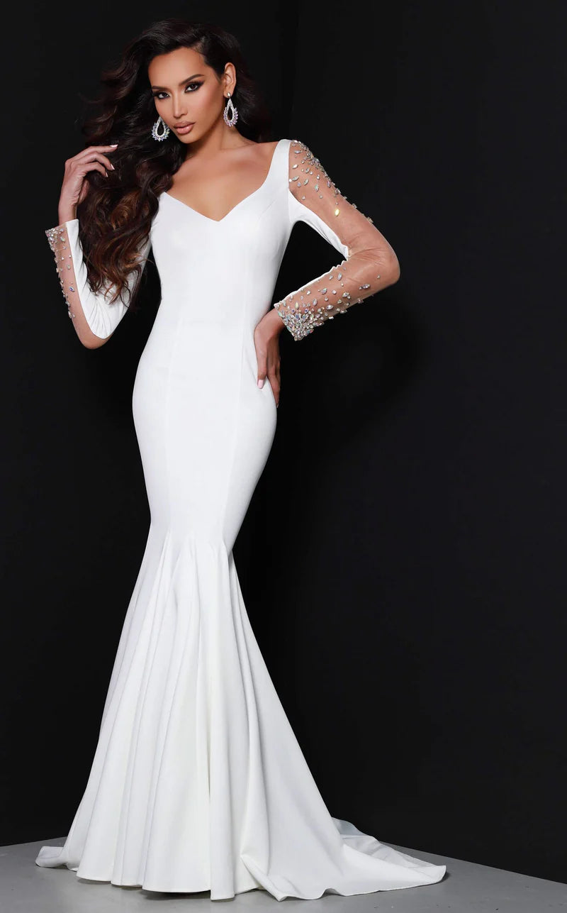 Johnathan Kayne 2441 This is a heavy knit evening gown with mesh sleeves. The hand sewn crystals add the perfect touch of glam to the shoulders and wrists, while the low back gives us a dramatic feel.

Available Colors: White

Available Sizes:&nbsp;&nbsp;8