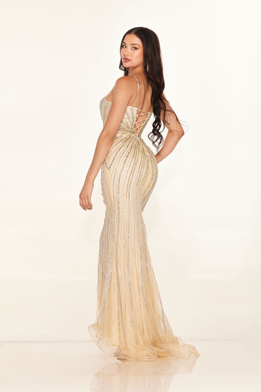 Elevate your style with the Cecilia Couture 2616 Long Crystal Prom Dress. This stunning gown features a corseted bodice and a dazzling crystal shimmer, perfect for any formal evening event. The V neckline adds a touch of elegance, making you stand out in the crowd. Feel confident and beautiful in this glamorous dress.