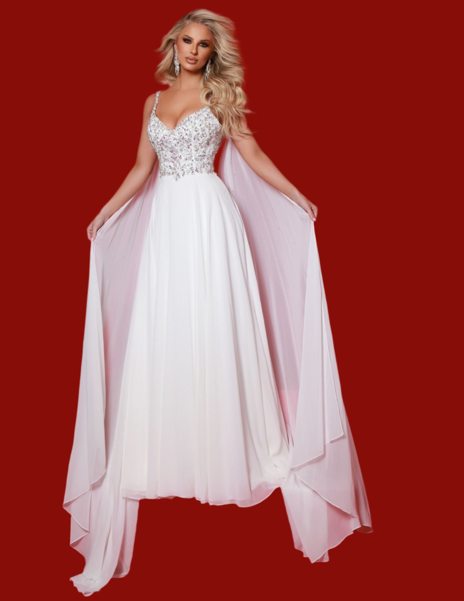 Expertly designed by Johnathan Kayne, this stunning A Line Pageant Dress features a glamorous crystal embellished cape, a flowy chiffon skirt, and a sophisticated V neckline. Step onto the stage in style and exude confidence with this must-have prom dress. Buy now or cry later! Transform into your most fabulous self with this enchanting dress. With the beaded bodice and magical shoulder cape attachments, you'll fly far away from basic.

Sizes: 00-20

&nbsp;Colors: Aqua, Hot Pink, Lemon, White