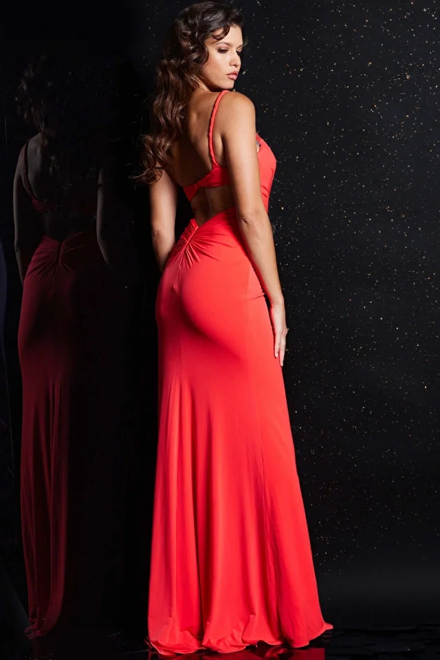 Introducing the Jovani 38309, an alluring and elegant prom dress from our formal collection. Crafted from luxurious jersey material, this fitted gown is designed to make you feel confident and glamorous. Its ruched bodice with a captivating cut-out detail adds a touch of intrigue, while a high slit adds a hint of allure, making it perfect for a sexy yet sophisticated look. The dress boasts a floor-length hem, and its open back design exudes drama and sophistication.