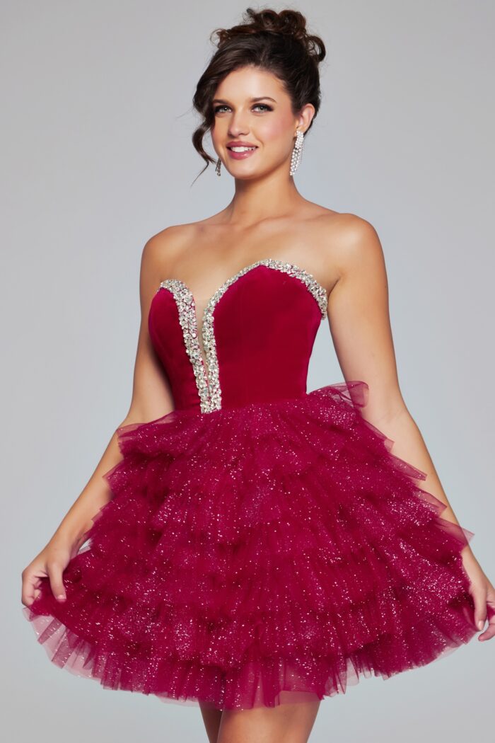 Expertly designed by Jovani, the 40352 Velvet Short Cocktail Dress offers a stunning combination of velvet bodice and layered tulle skirt. The strapless sweetheart neckline is adorned with sparkling crystals, making this gown perfect for homecoming or pageant events.