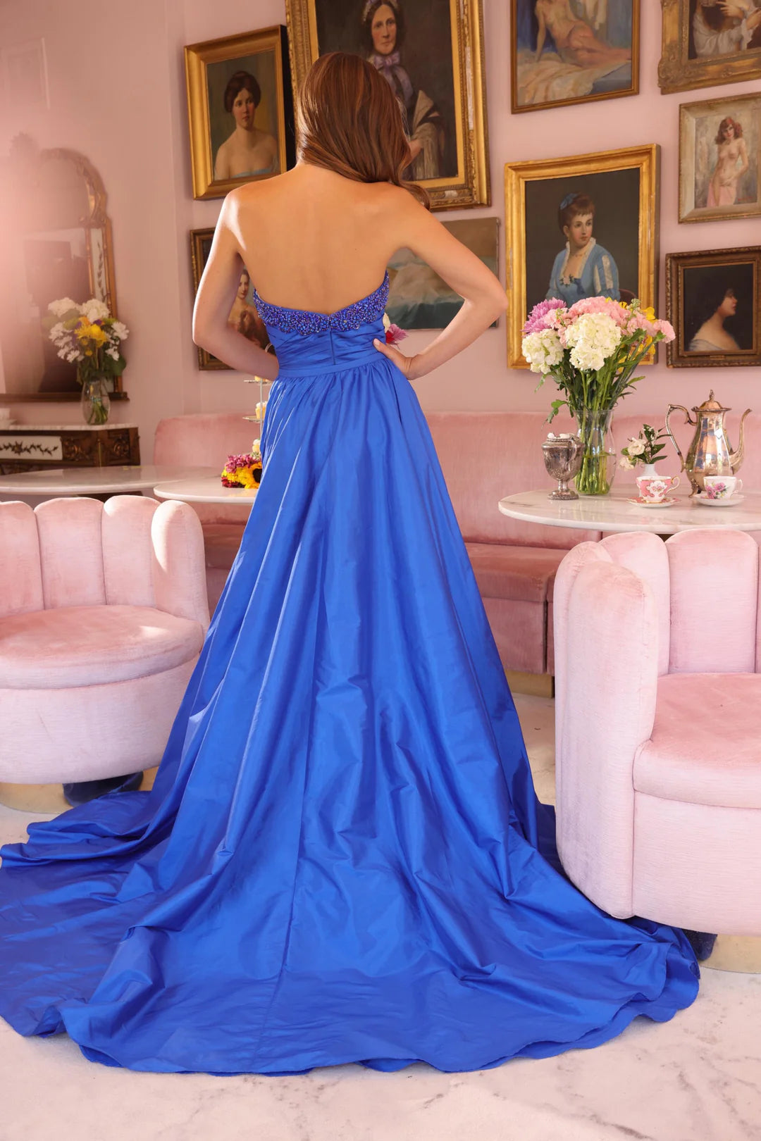 Step into the spotlight with the stunning Ava Presley 40523 pageant dress. Its fitted silhouette is elegantly complemented by a crystal-studded bodice and a ruched taffeta train, while an overskirt with a slit adds a touch of drama. Make a statement and stand out with this expertly crafted dress.