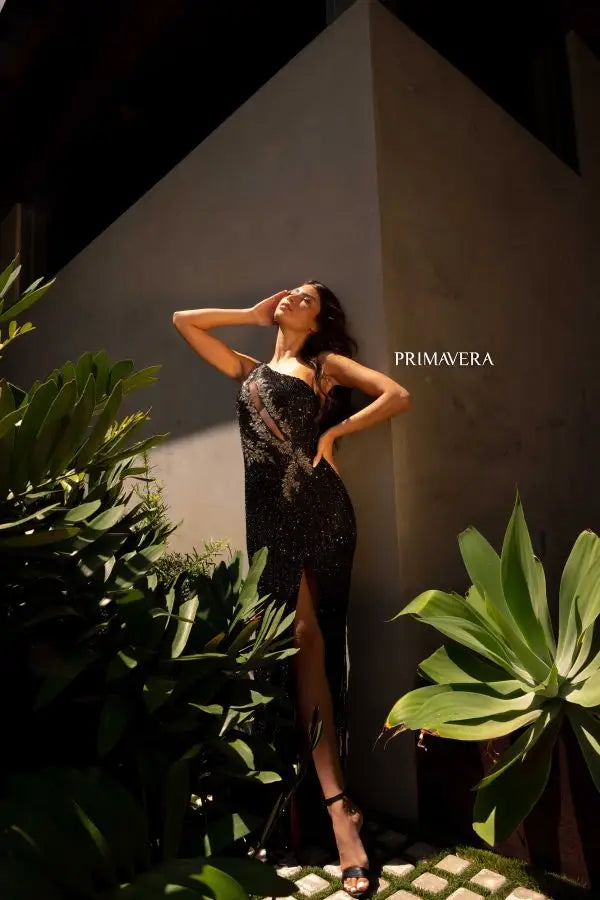 Expertly crafted by Primavera Couture, the 4144 Long Prom Dress is a stunning choice for any formal occasion. The fitted body and cut out design provide a sleek and modern look, while the sheer high slit adds a touch of elegance. Complete with a lace up back, this gown promises to make you feel confident and sophisticated.