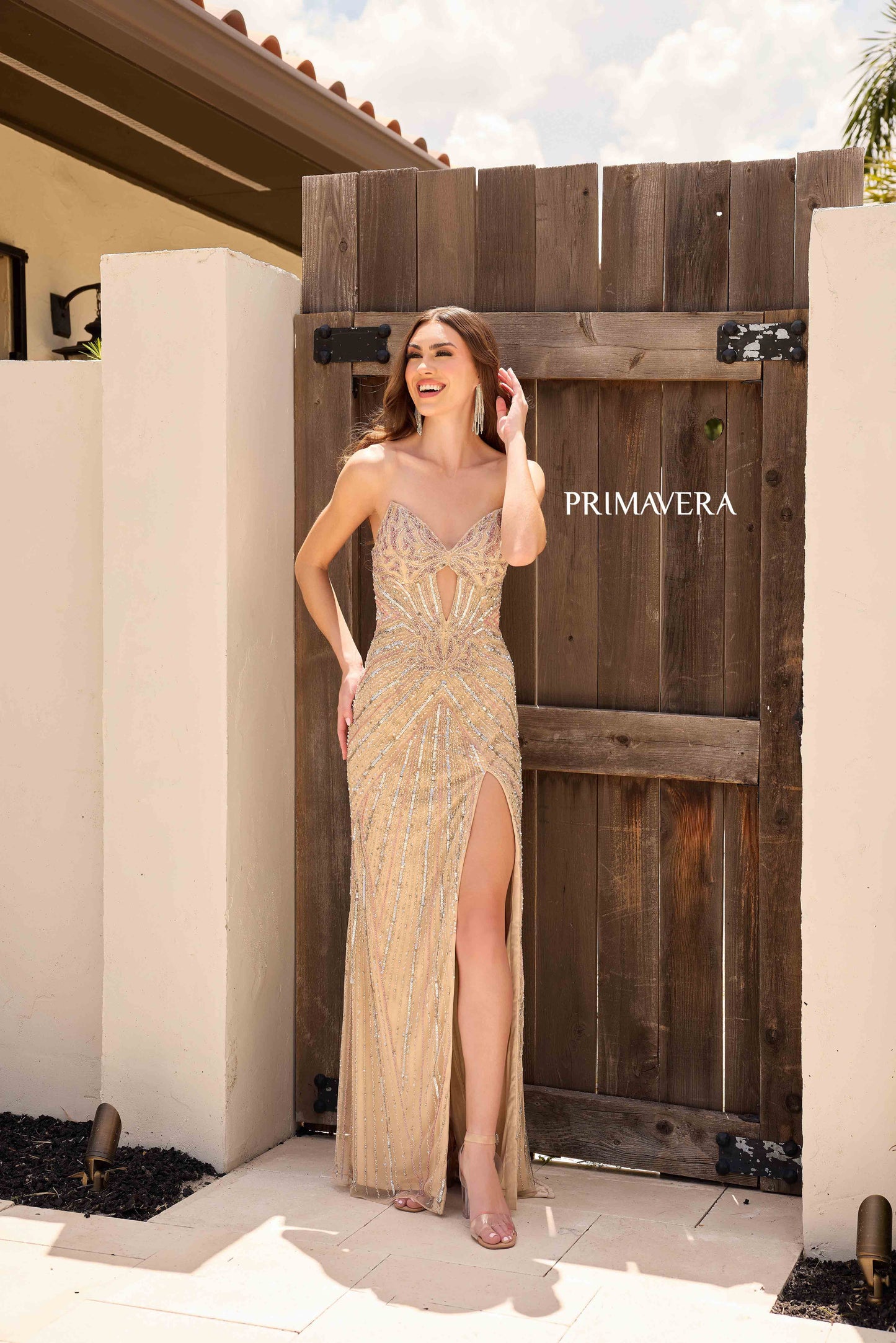 This Primavera Couture 4309 Prom Dress features intricate beading and sequin detailing, with a flattering corset silhouette and dramatic slit. Perfect for any formal occasion, this strapless gown exudes elegance and sophistication. Make a statement and turn heads with this stunning, high-quality dress.

Sizes: 000-18

Colors: Black, Nude, Peacock, Powder Blue