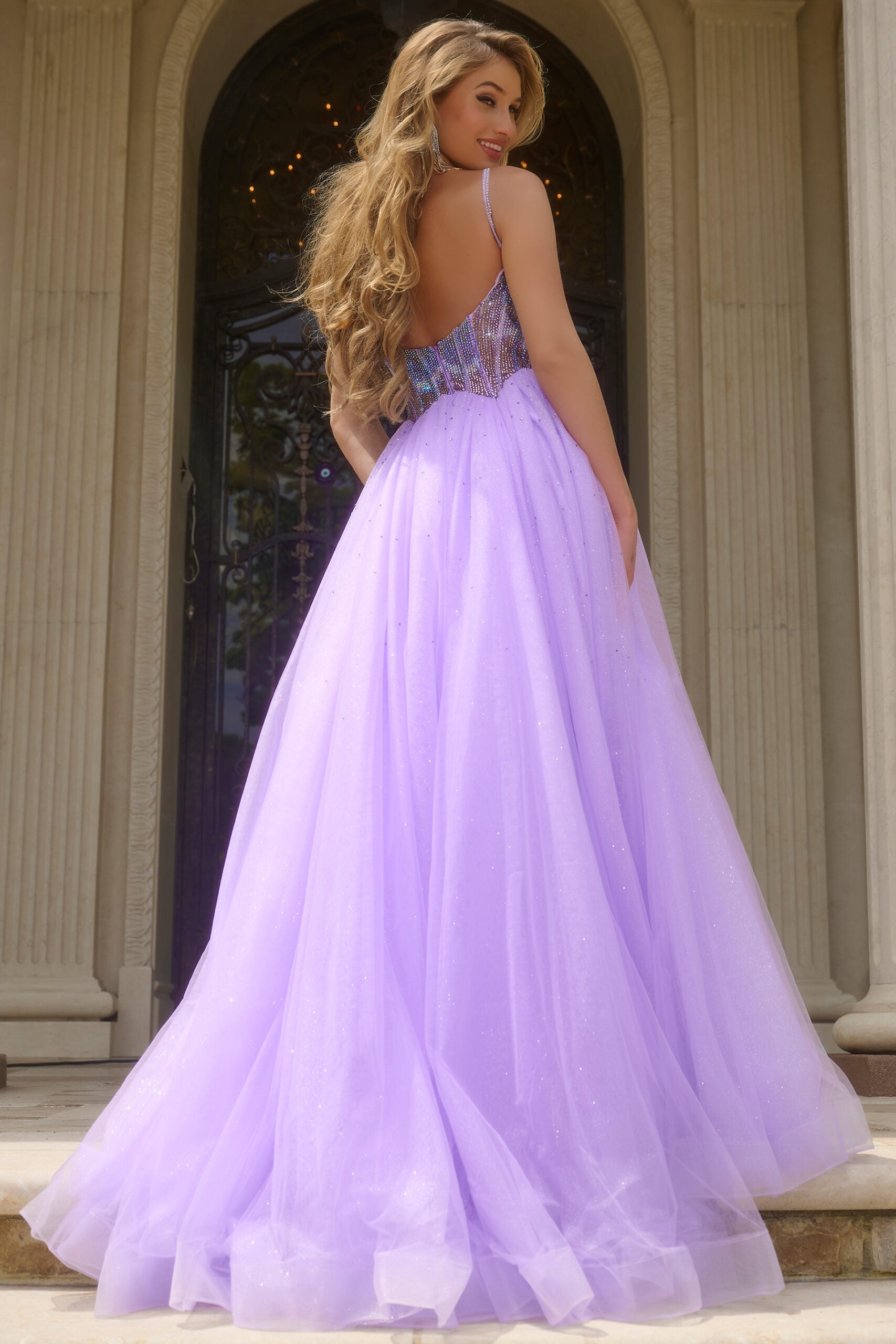 Indulge in luxury with the Jovani 44511 prom dress. Dazzling crystal bodice, A-line silhouette and shimmering sequins create a glamorous look. The scoop neck adds an elegant touch while the tulle and formal design elevate the style. Perfect for prom or pageants. Step into elegance with this exquisite ball gown, featuring a fitted beaded corset bodice that shimmers with intricate details. 