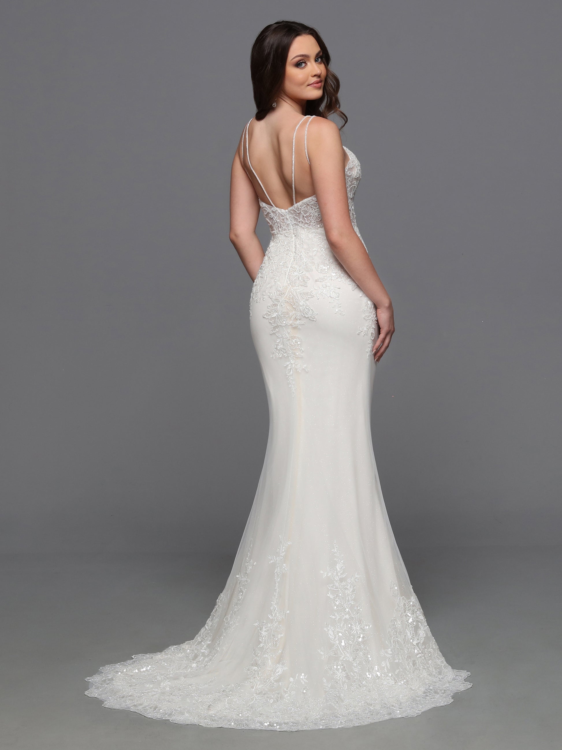 Elevate your bridal look with the Davinci Bridal 50843 wedding dress. This luxurious gown features a sheer embroidered bodice with intricate beading, adding a touch of glamour to your special day. The detachable overskirt adds a layer of versatility, making this gown perfect for any venue. Sparkle and shine with the sequin details, making you the star of the show. The detachable tulle skirt turns this pretty lace slip dress design into a full-fledged ball gown wedding dress.