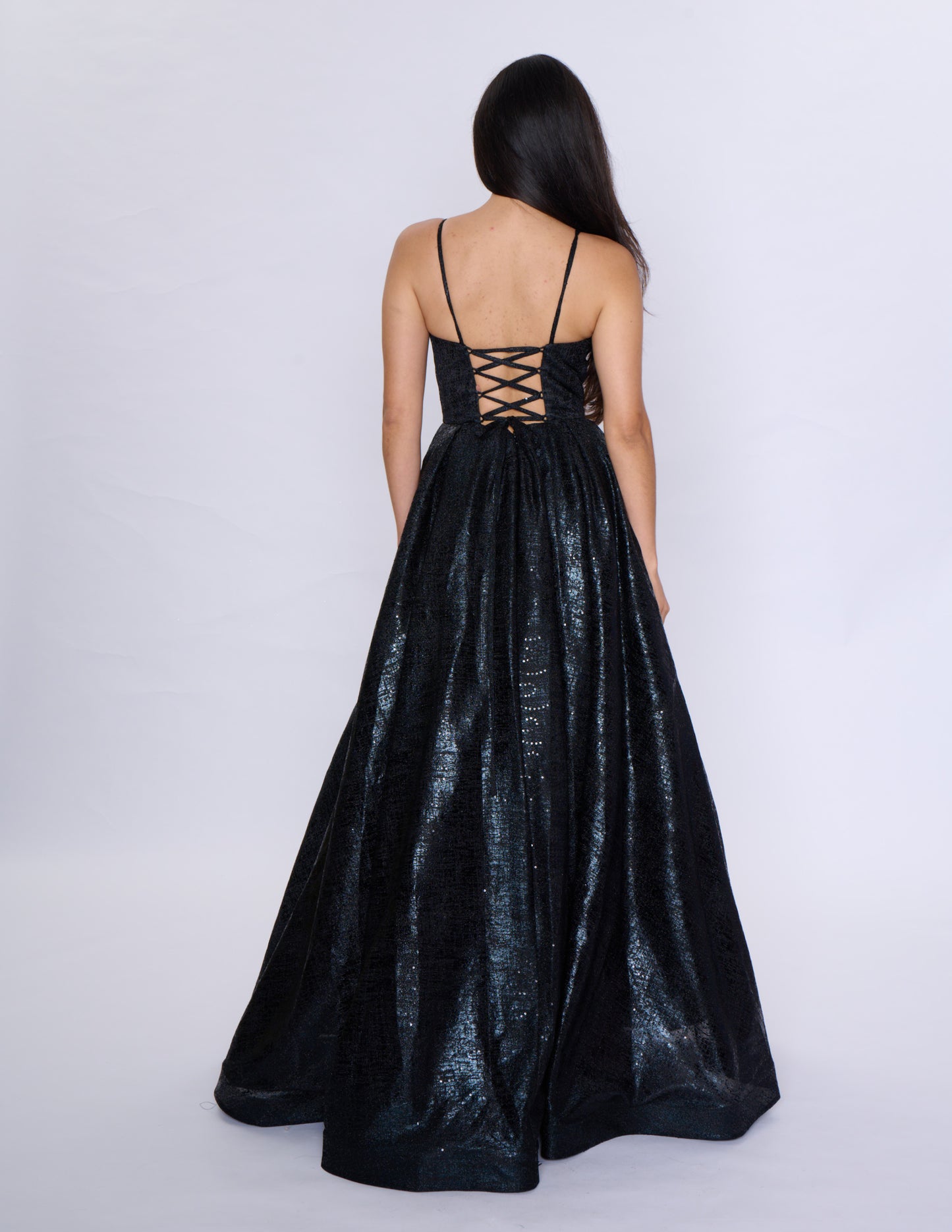 Elevate your formal attire with the Nina Canacci Metallic Ballgown. Stunningly designed with a corset-style bodice and V-neckline, this A-line gown exudes elegance and grace. Made with a metallic fabric, it adds a touch of shimmer to your look. Perfect for prom or any formal event, this dress will make you feel like royalty.

Sizes: 2-18

Colors: Black, Aqua, Rose