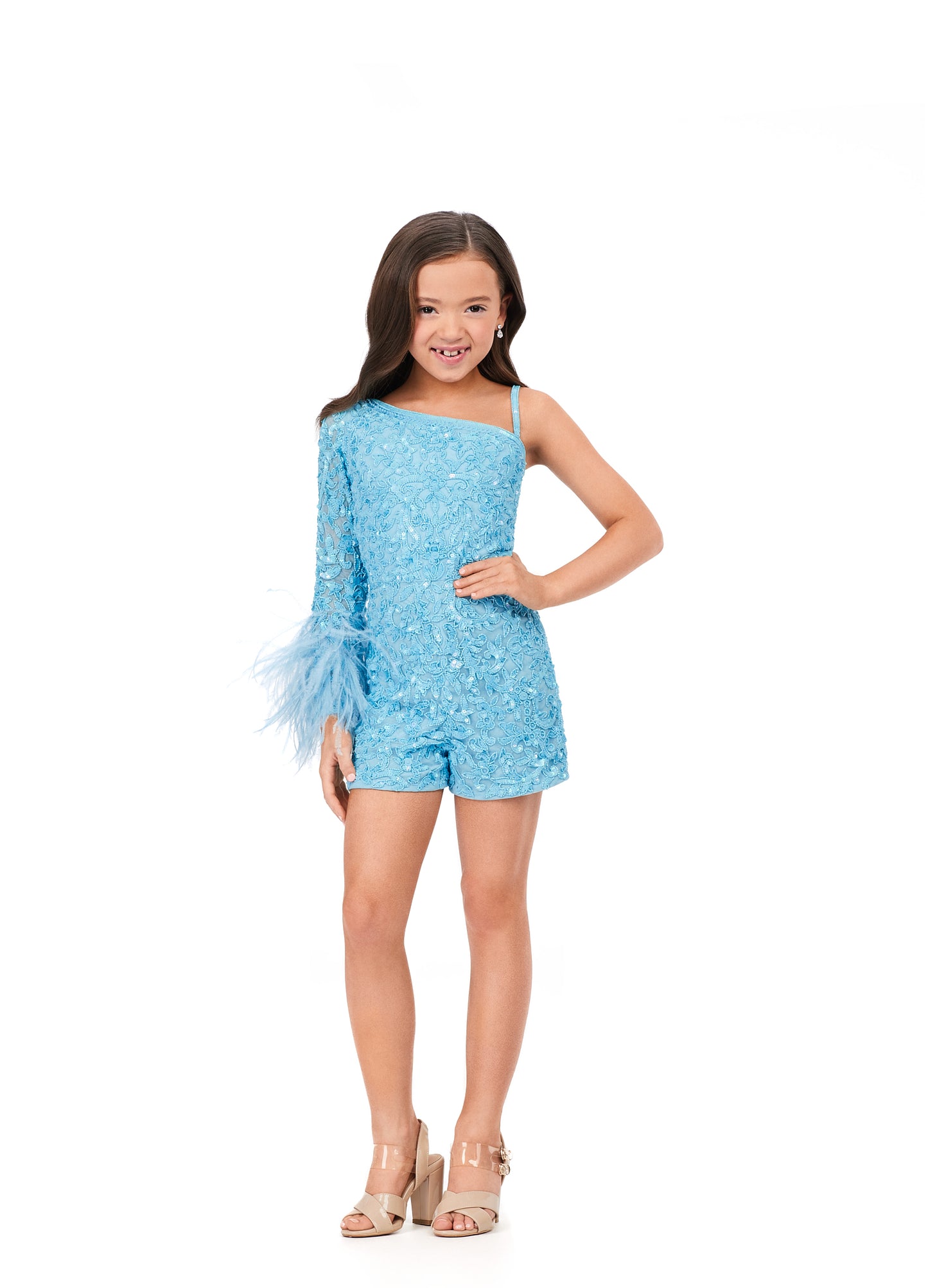 Ashley Lauren Kids 8192 One Shoulder Long Sleeve With Feather Detail Fully Beaded Romper. The cutest romper you ever did see! This one shoulder beaded romper features feather details on the wrist that gives the perfect amount of sass.