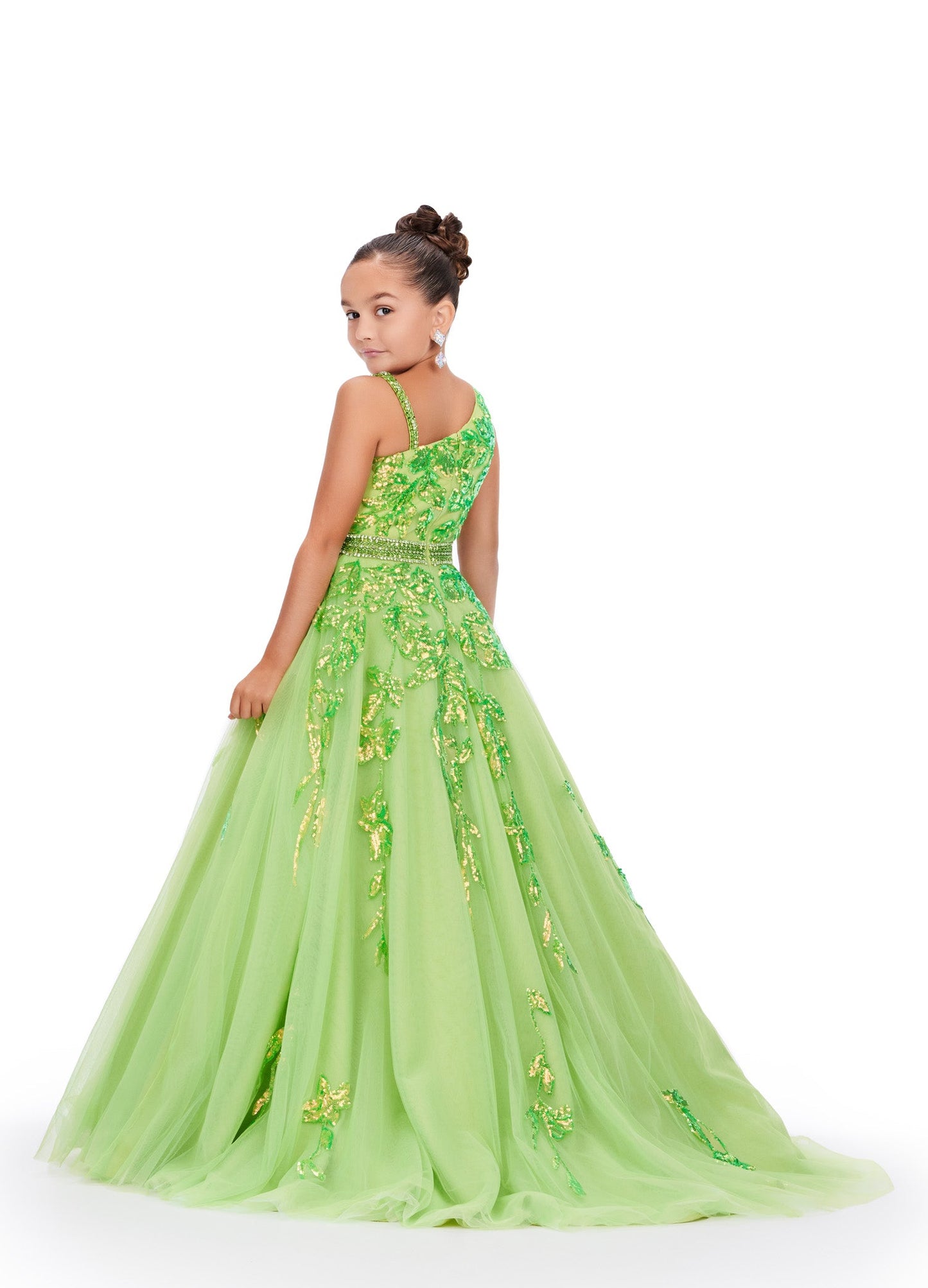 Get ready to dazzle in this stunning Ashley Lauren Kids 8240 Girls Ballgown! With its long tulle skirt and intricate sequin and lace detailing, this one-shoulder dress will make your little one feel like a pageant princess. Expertly crafted, this dress exudes elegance and sophistication. This one shoulder kids tulle ball gown features a sequin applique bodice giving way to a beaded waistline. The sequin applique trickle down onto the full a-line skirt.