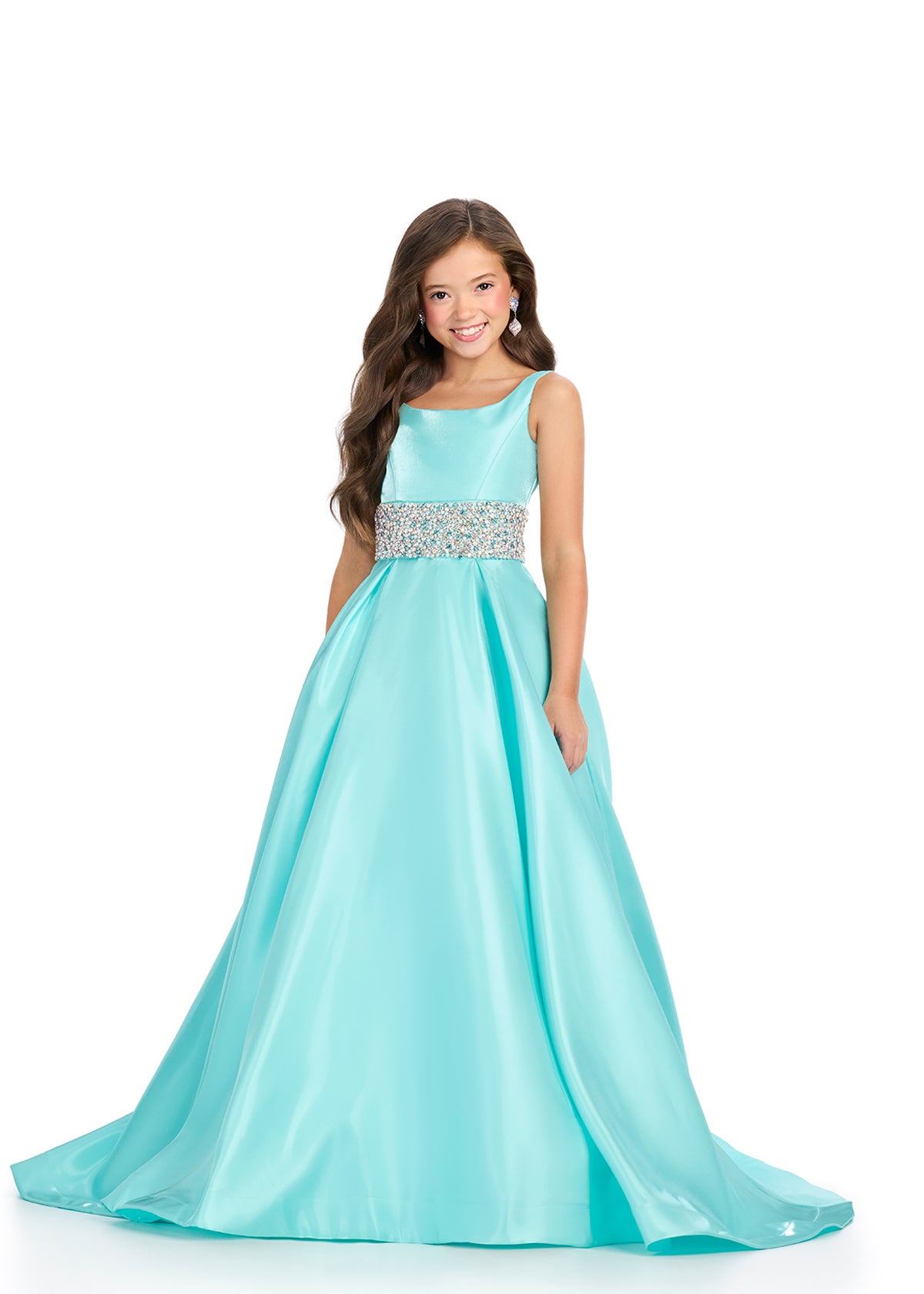 Indulge in luxury and sophistication with the Ashley Lauren 8276 Girls Satin Ballgown. This exquisite piece features a beautiful satin fabric that flows effortlessly, while the embellished crystal waistline adds a touch of glamour. Perfect for your little princess, this ballgown will make her feel like royalty.