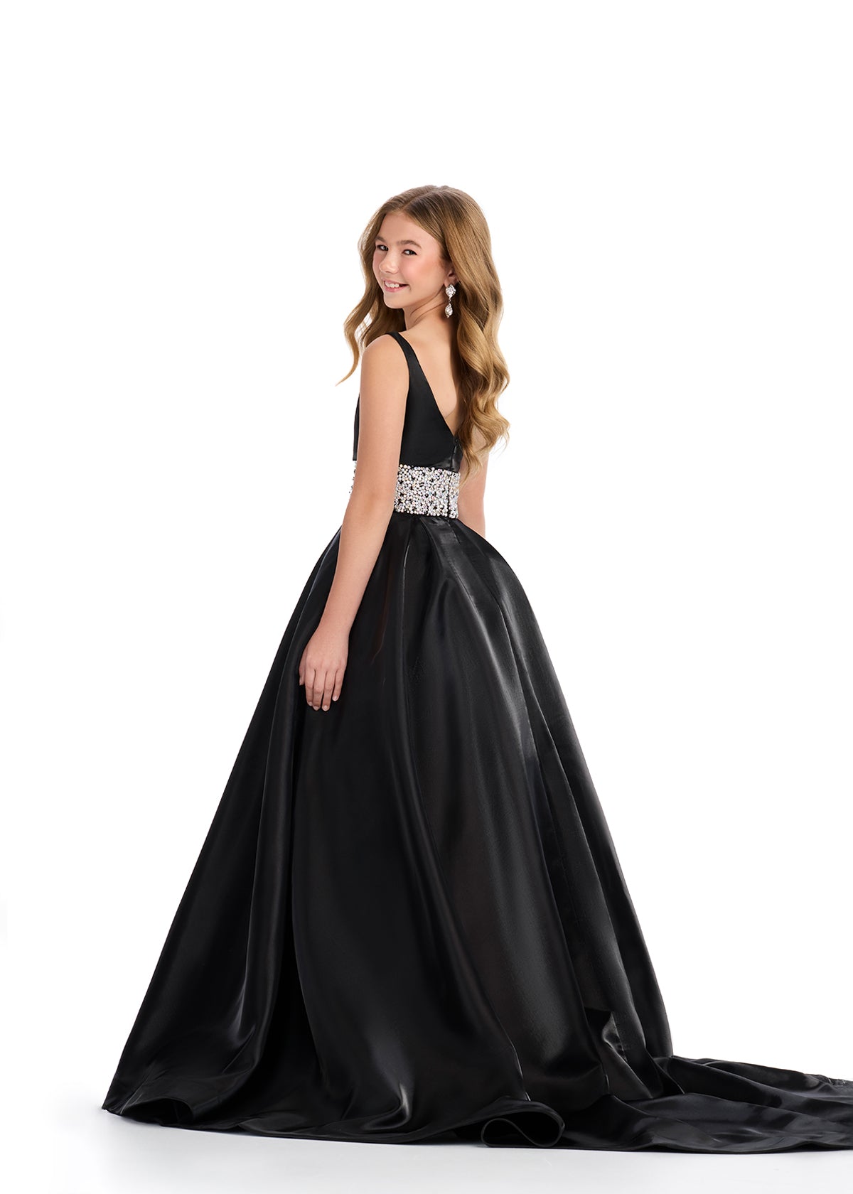 Indulge in luxury and sophistication with the Ashley Lauren 8276 Girls Satin Ballgown. This exquisite piece features a beautiful satin fabric that flows effortlessly, while the embellished crystal waistline adds a touch of glamour. Perfect for your little princess, this ballgown will make her feel like royalty.