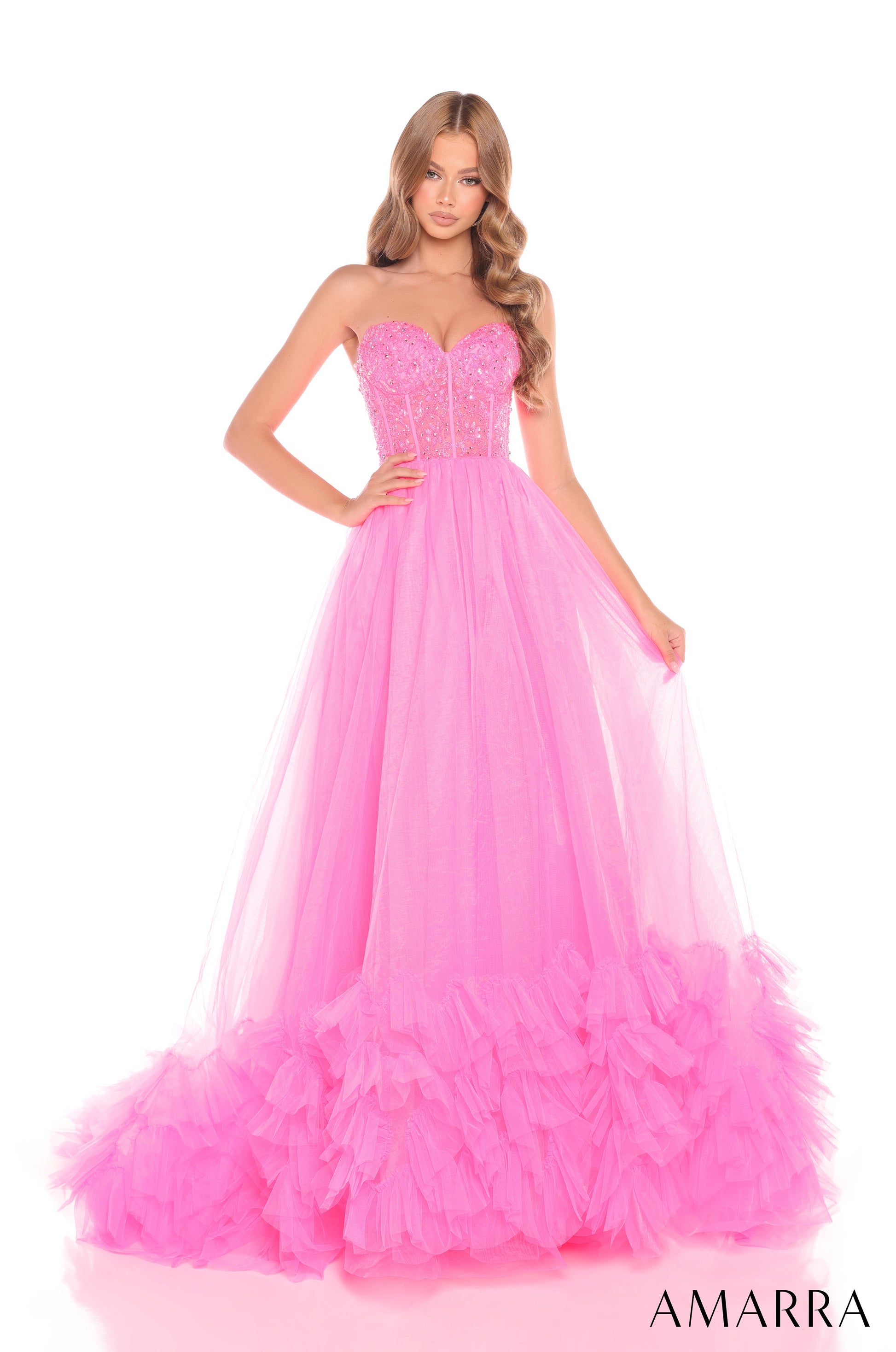 Expertly crafted with a sheer beaded corset, this Amarra 88339 prom dress offers impeccable style and elegance. The layers of pleated tulle create a striking ballgown silhouette that is sure to turn heads. Perfect for pageants or special occasions, this dress is a must-have for any fashion-forward individual.

Sizes: 000-16

Colors: Hot Pink,&nbsp;Light Blue,&nbsp;Light Pink,&nbsp;Lilac,&nbsp;Nude/Gold,&nbsp;Red