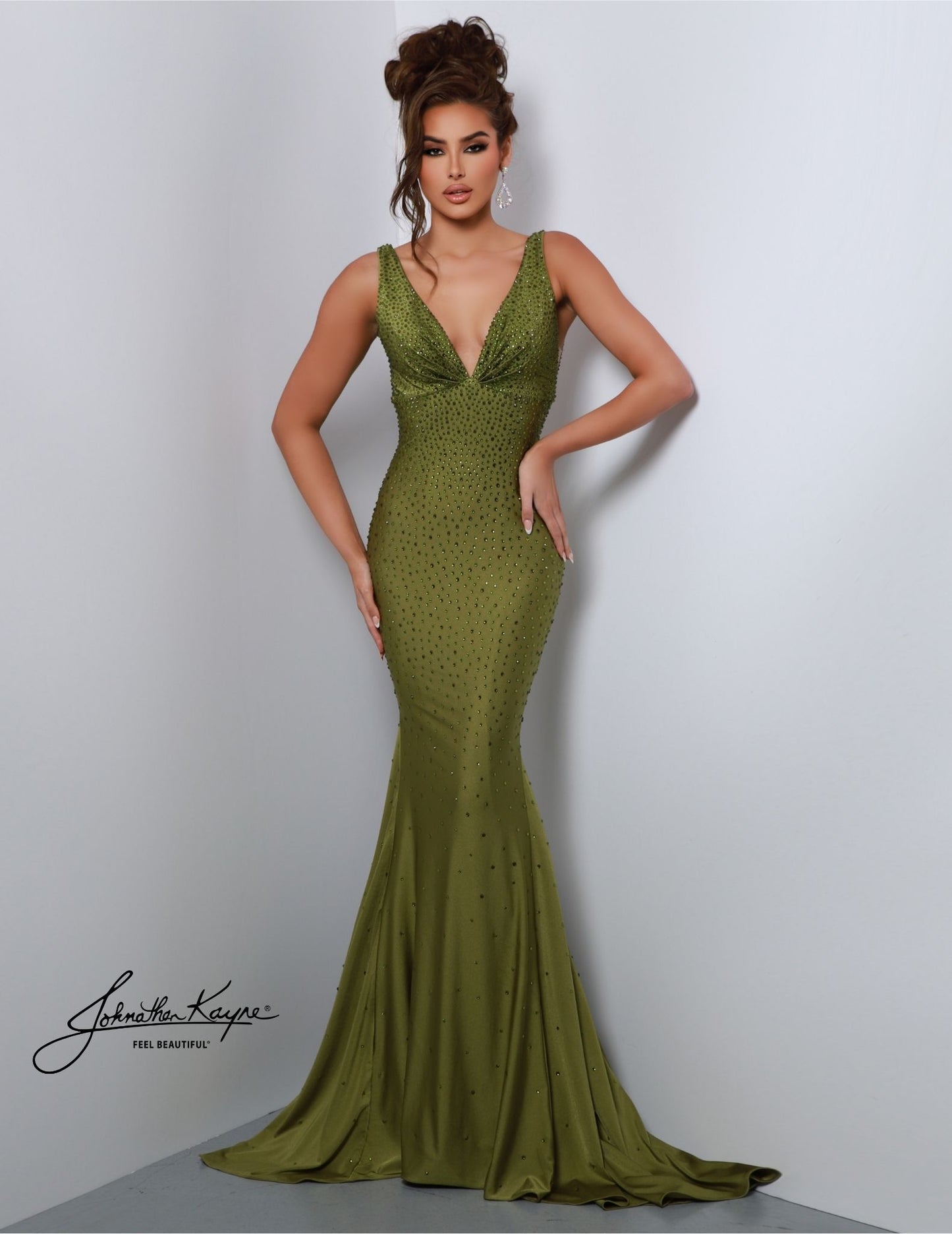 Johnathan Kayne 9213 is an embellished stretch Prom Dress, Pageant Gown & Formal Evening Wear. One of Johnathan Kayne's favorite styles for the Fall season, this elegant 4 way stretch lycra gown has a modern empire bodice and hugs the body all the way to the dramatic train. Adorn in shimmering crystals, this gem of a gown will turn heads.