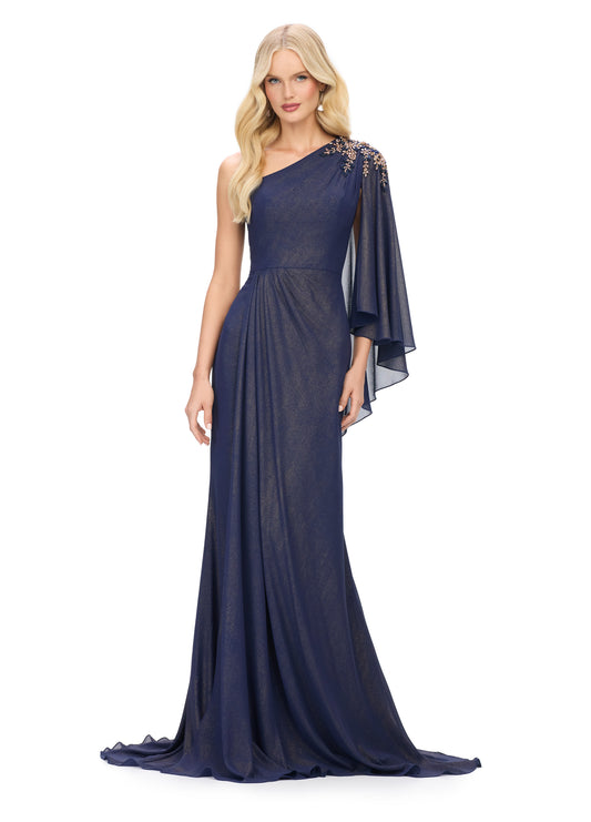 The Ashley Lauren 11701 evening gown boasts a one shoulder design with a single flowy chiffon sleeve, a ruched waist, and an embellished shoulder. This elegant and sophisticated dress is perfect for any special occasion, providing a flattering silhouette and eye-catching details. Elevate your evening look with this stunning piece.