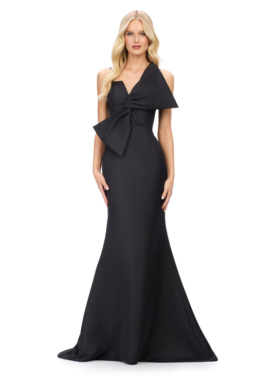 This Ashley Lauren 11702 evening gown boasts a striking large bow, spaghetti straps, and a flattering fit and flare silhouette. The bow bodice adds a touch of elegance, while the V neckline highlights your décolletage. Perfect for formal events and special occasions, this gown is sure to turn heads.