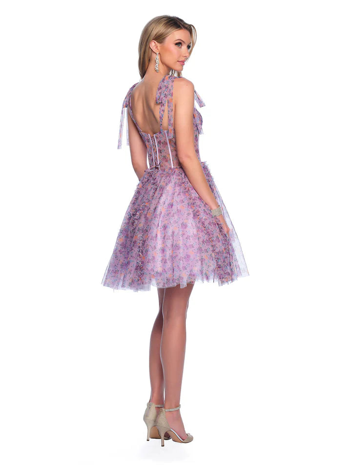 This Dave &amp; Johnny 11752 gown features a pleated print, flared silhouette, and bow detail, perfect for homecoming. The floral ruffle skirt adds a playful touch. Expertly crafted with high-quality materials, this dress offers both style and comfort. A must-have for any formal occasion. sheer corset