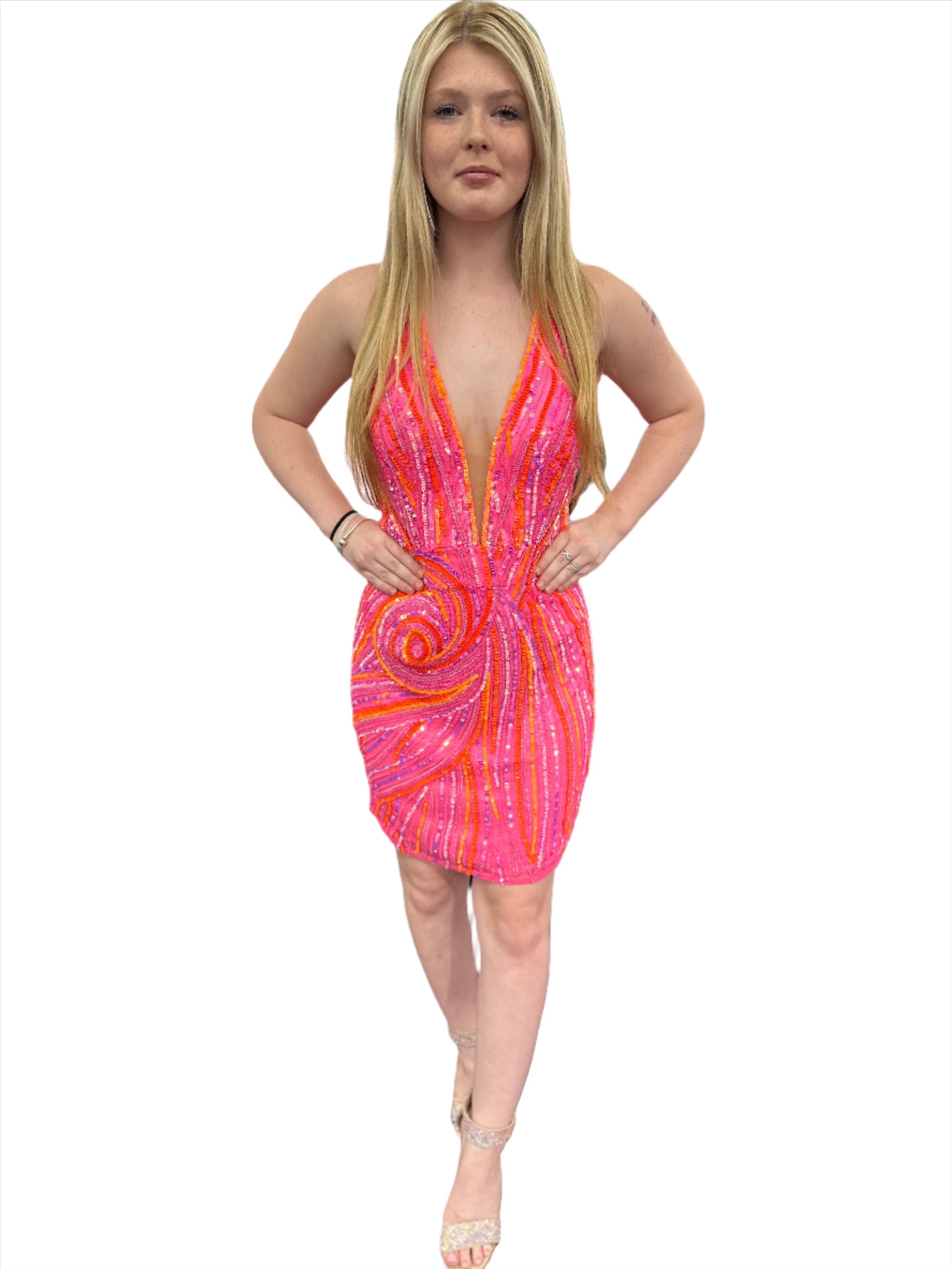 Introducing the Ashley Lauren 4791 Halter Formal Cocktail Dress. With sequins and a backless design, this dress is perfect for formal events and homecoming. Its halter neckline adds an elegant touch, while the short gown shows off your legs. Look and feel amazing in this exclusive piece.  Colors:&nbsp; Orchid, Black, Hot Pink, Jade, Royal