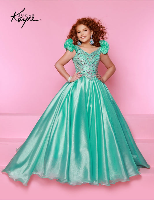 Bring out her inner beauty with this Sugar Kayne C334 Girls Pageant Dress. This luxurious dress is made from iridescent organza and features a sweetheart neckline and long ball gown skirt. Perfect for any special occasion. Transform into a twinkling starlet with this Metallic Organza Gown. The beaded bodice adds a touch of sparkle to this enchanting ensemble. The delicate ruffle sleeves create a charming look!