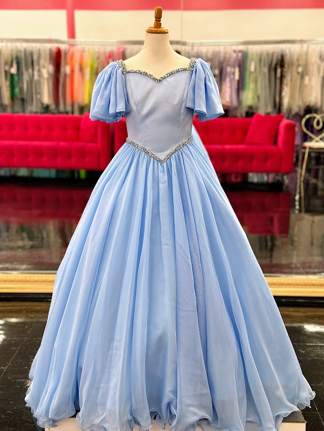 Make your little girl feel like a princess in the Samantha Blake 1126 Girls Pageant Dress. Featuring Chiffon ruffle cap sleeves and a satin bodice, this formal gown exudes elegance and charm. With an A-line silhouette, it flatters any figure and is perfect for pageants or special occasions.