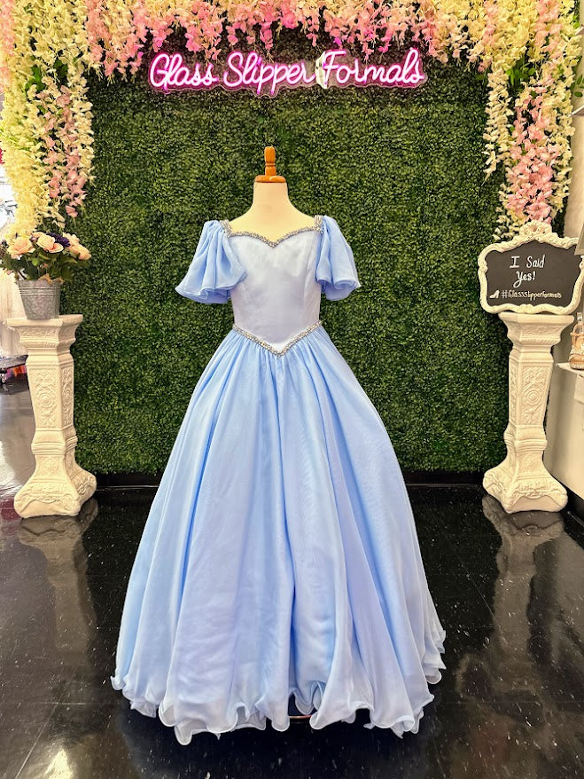 Make your little girl feel like a princess in the Samantha Blake 1126 Girls Pageant Dress. Featuring Chiffon ruffle cap sleeves and a satin bodice, this formal gown exudes elegance and charm. With an A-line silhouette, it flatters any figure and is perfect for pageants or special occasions.