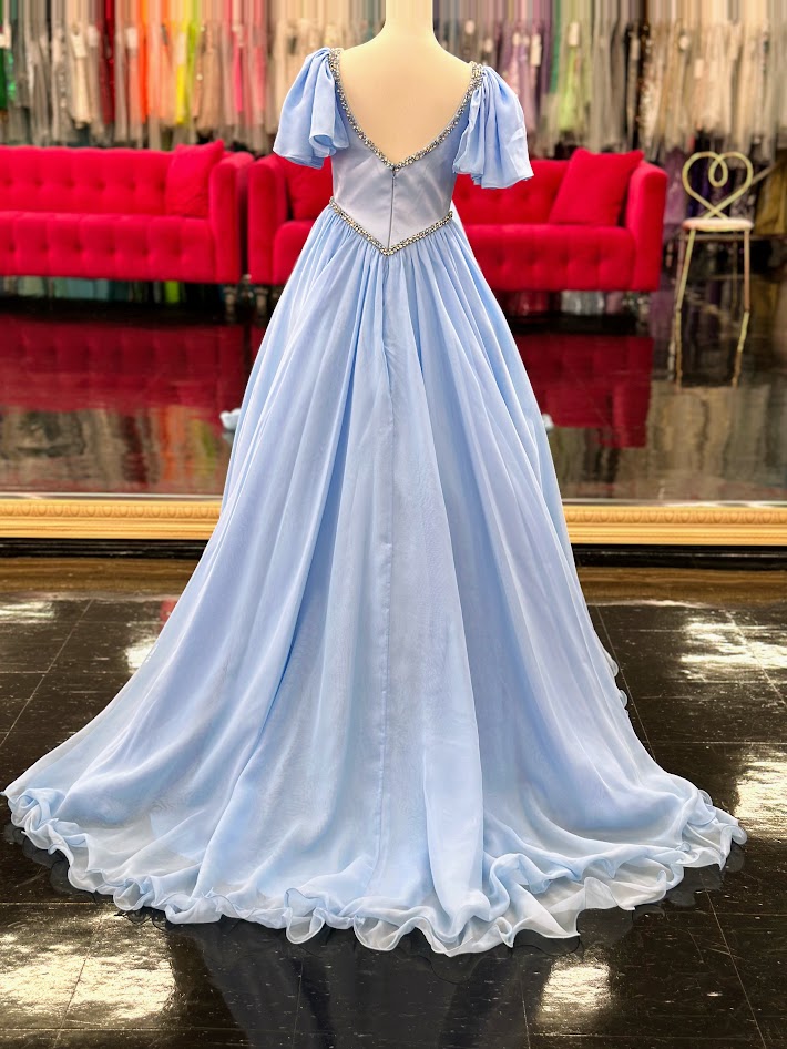 Make your little girl feel like a princess in the Samantha Blake 1126 Girls Pageant Dress. Featuring Chiffon ruffle cap sleeves and a satin bodice, this formal gown exudes elegance and charm. With an A-line silhouette, it flatters any figure and is perfect for pageants or special occasions.