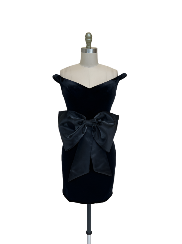 Ashley Lauren 4643 Velvet Fitted Off The Shoulder V-Neck With Satin Bow Cocktail Homecoming Dress.&nbsp;This Ashley Lauren 4643 velvet fitted off the shoulder dress features a beautiful V-neck with a sophisticated satin bow that adds elegance to the dress. The fitted silhouette gives you a stylish yet comfortable look for your homecoming or cocktail events.