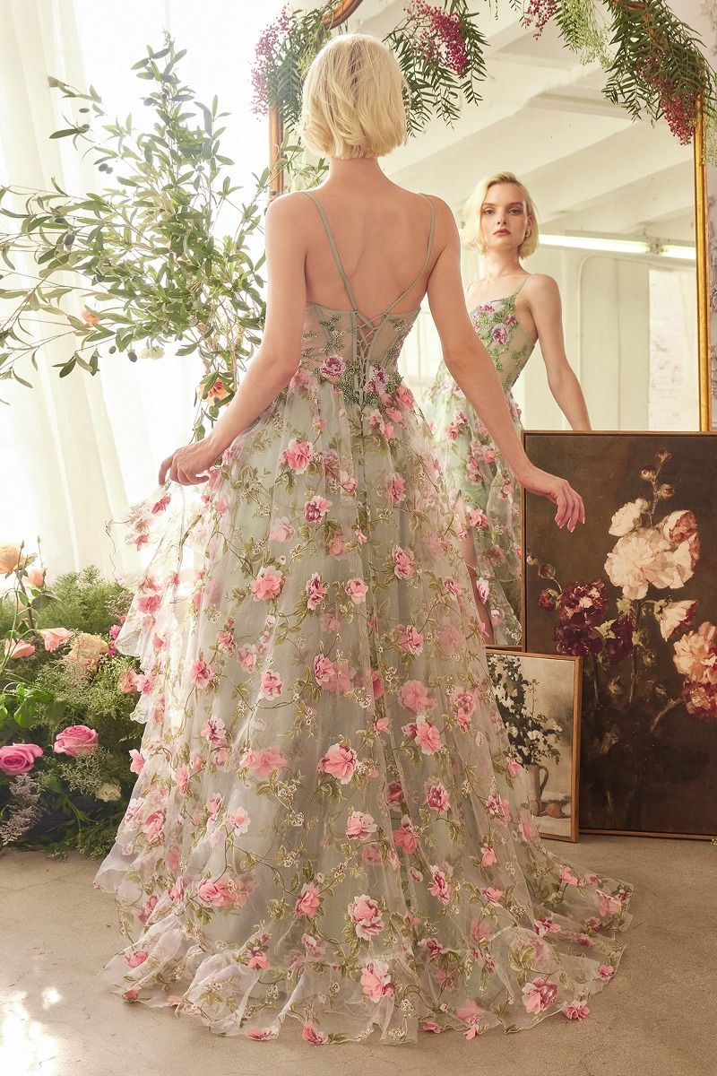 This stunning Andrea &amp; Leo Couture A1420 dress features a beautiful ruffle A-line design with a sheer corset top for a flattering silhouette. The layered floral print adds a touch of elegance to this prom dress. Feel confident and chic in this must-have gown. This enchanting A-line gown features a sweetheart neckline, delicate thin straps, and a sheer structured bodice adorned with floral prints. Crafted from layered organza, the ruffle skirt cascades gracefully, creating a romantic and flowy silhouette