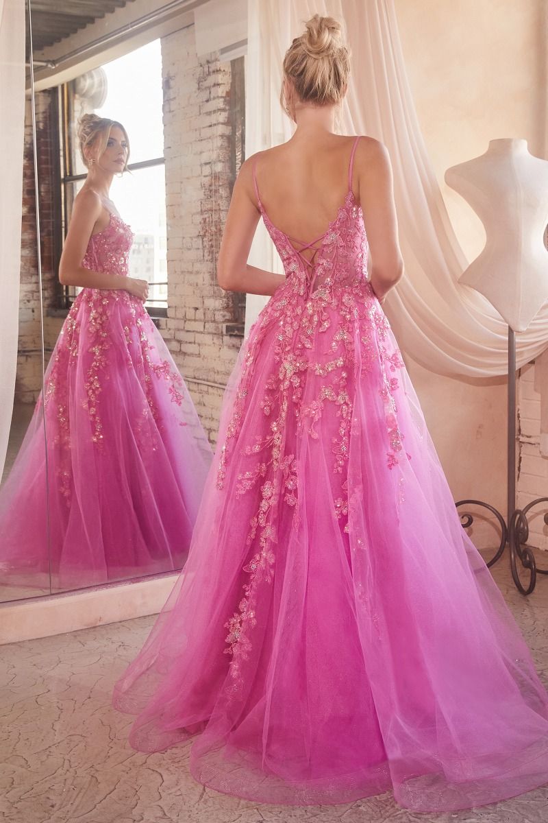 Be the belle of the ball in this stunning Andrea & Leo Couture CM347 prom dress. The sheer lace and sequin details create an elegant and sophisticated look, while the corset and A-line silhouette provide a flattering fit. Perfect for any formal event, this gown is sure to turn heads and make you feel like a true princess. Bring elegance and charm to your next special event in this playful lace & tulle ball gown. 