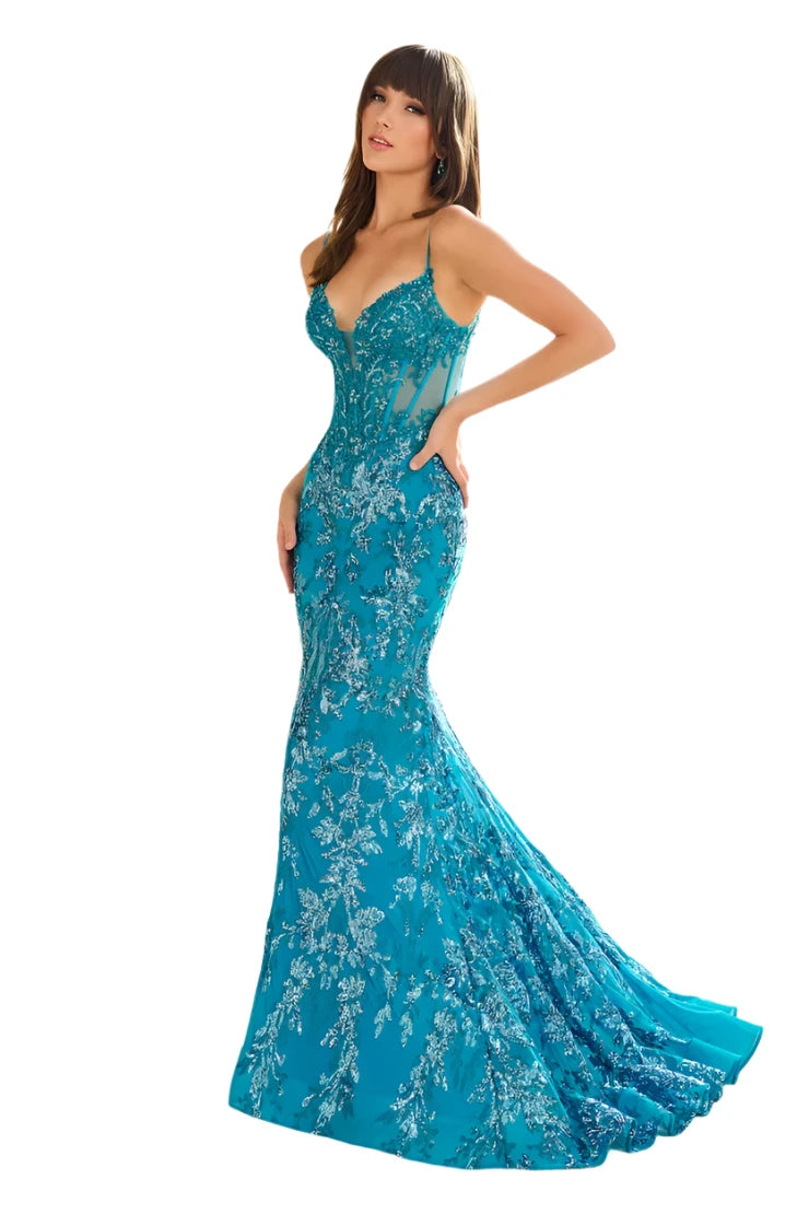 Expertly designed by Ellie Wilde, the EW36003 Sheer Corset Sequin Mermaid Backless Prom Dress is a stunning and luxurious choice for any formal event. The sheer corset beautifully accentuates the figure while the sequin detailing adds a touch of glamour. With its backless design, this elegant gown is perfect for a pageant or evening affair.