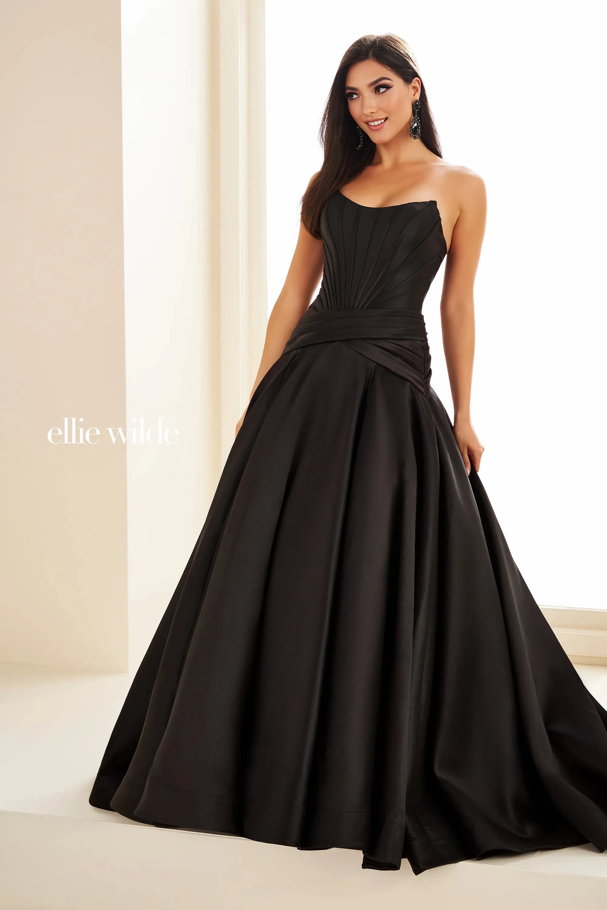 Expertly crafted for the most discerning of customers, the Ellie Wilde EW36105 Mikado A Line Dress is a symbol of elegance and sophistication. The drop waist design and ballgown silhouette create a flattering and timeless look, while the scoop neck adds a touch of femininity. Perfect for prom, pageants, or any formal occasion, this dress is sure to make a statement.