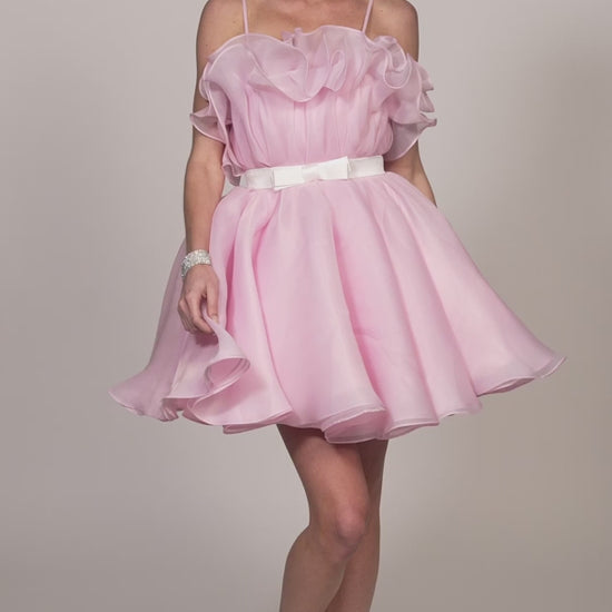 This Dave &amp; Johnny 11730 dress features a cupcake-style ruffle skirt, a flattering babydoll silhouette, and a playful ribbon accent. Perfect for homecoming or any other special occasion, this cocktail dress will make you stand out with its unique design. The ruffled skirt adds a fun and youthful touch, while the babydoll silhouette flatters your figure. The ribbon detail adds a touch of elegance, making this dress a versatile option for any event.