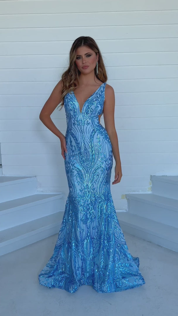 This elegant Ava Presley 39204 long prom dress is a perfect choice for any formal occasion. The fitted mermaid silhouette and plunging v neckline create a sophisticated and flattering look. Made with high-quality materials, it offers both comfort and style. You'll feel confident and stunning in this formal pageant gown.