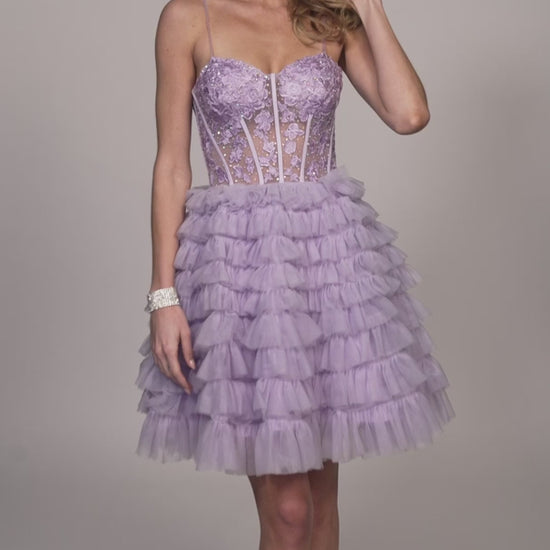 Elevate your look with the Dave &amp; Johnny 11766 Layer Ruffle A Line Homecoming Dress. The sheer lace corset and layered ruffles create a flattering A-line silhouette, perfect for any cocktail event. This dress combines style and comfort, making it a must-have for your