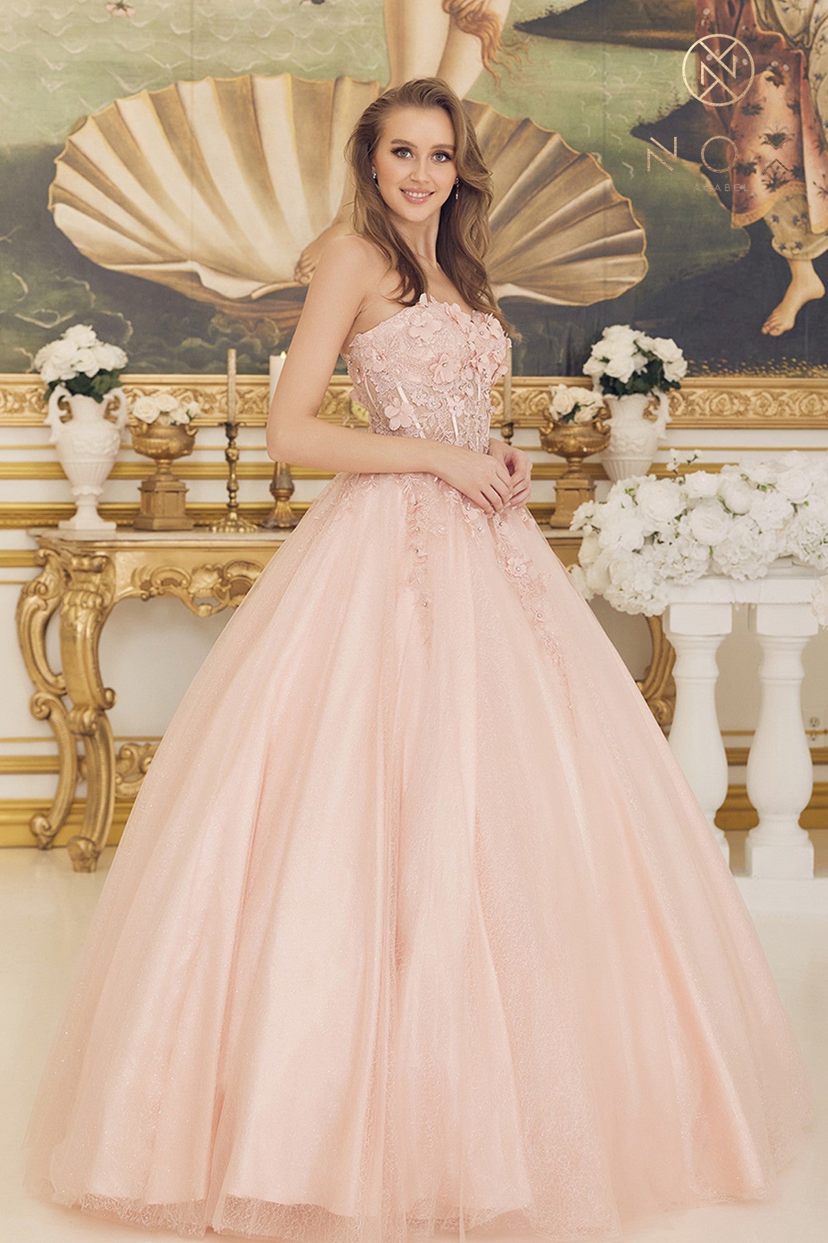 This elegant Nox Anabel CU 1194 Long #d Floral Lace Corset Ballgown Prom Dress Shimmer Formal Gown offers classic styling with a beautiful lace and shimmer fabric combination. Featuring a corset-style bodice with an ultra-flattering long flowing skirt. This dress is perfect for special occasions or proms.  Sizes: 2-16  Colors: Blush, Red