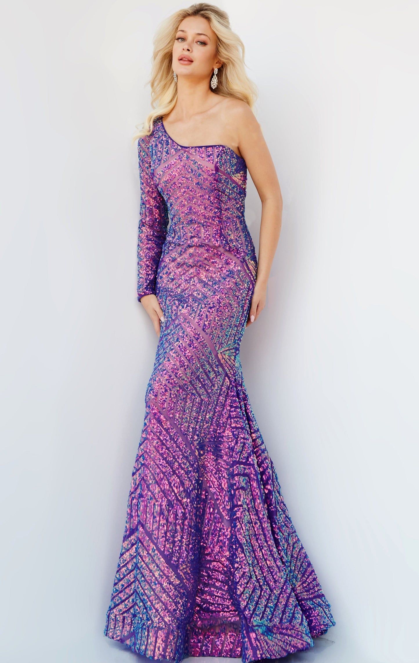 Jovani 24098 One Shoulder Long Sleeve Fitted Sequin Mermaid Prom Dress Pageant Gown Jovani 24098 is the perfect choice for a special occasion. It features a one-shoulder neckline, long sleeves, and a mermaid silhouette adorned with fantasy sequins. This fitted gown is designed to flatter, making you look and feel amazing.  Sizes: 00-24  Colors: EMERALD, IREDENSCNT BLUE, IRIDESCENT VIOLET, NEON HOTPINK, PEACOCK