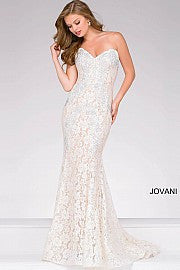 Jovani 37334 This beautiful, fitted, strapless lace dress features a sweetheart neckline. The top half of the trumpet dress is accessorized with rhinestones. Stretch nude lining with stretch lace overlay, heat set stones, form fitting, strapless. Available Sizes: 00,0,2,4,6,8,10,12,14,16,18,20,22,24  Available Colors: BLACK, BRIGHT PINK, DUSTY PINK, EMERALD, FUCHSIA, IVORY, LIGHT-BLUE, LILAC, MAUVE, NAVY, PERRIWINKLE, RED, ROYAL