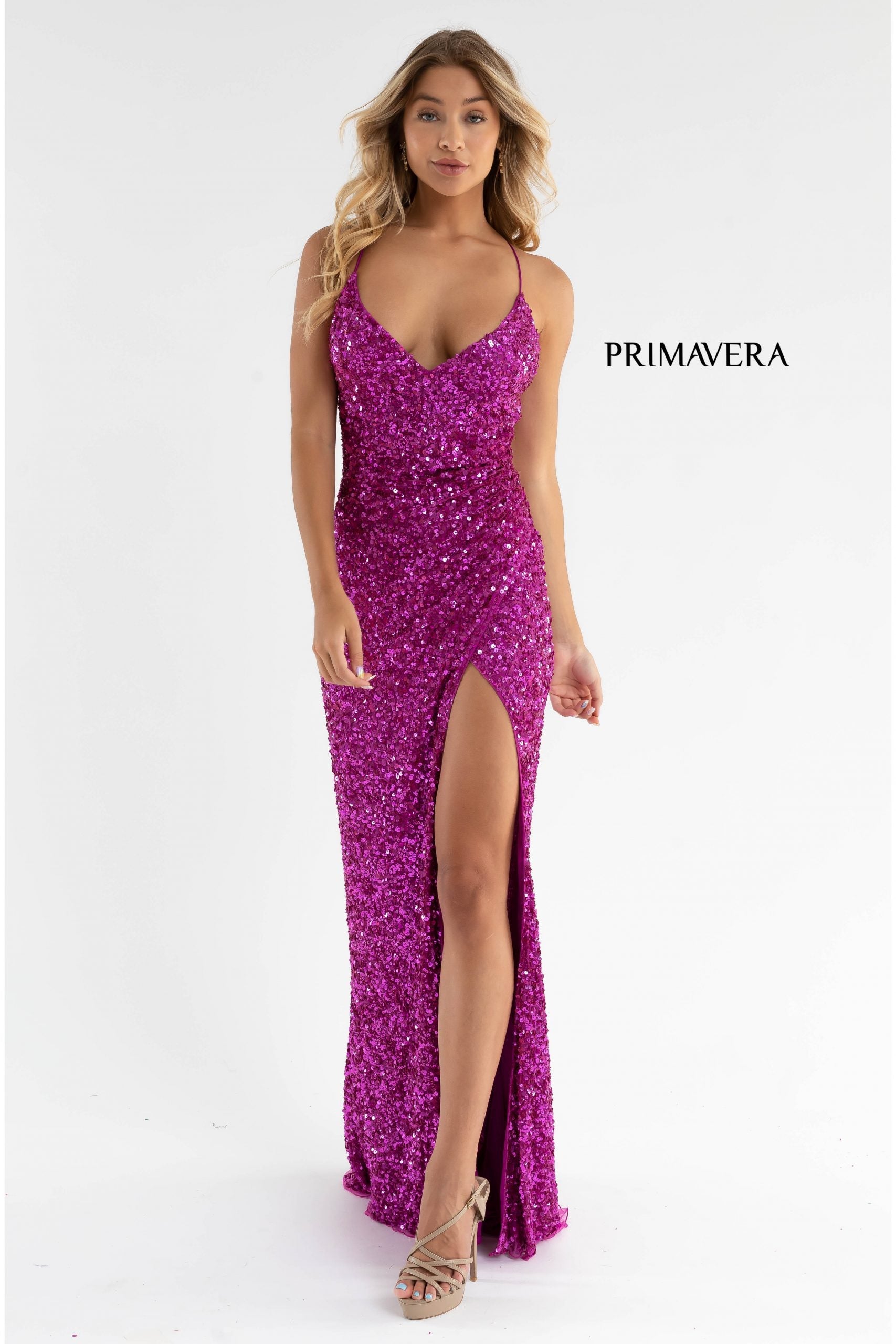 Primavera Couture 3791 Exclusive Prom Dress.  This is an all sequins prom dress with a V neckline and spaghetti straps that lace up and tie in the open back.  It has a wrap style side slit and a sweeping train.  Colors:  Fuchsia  Sizes:  4