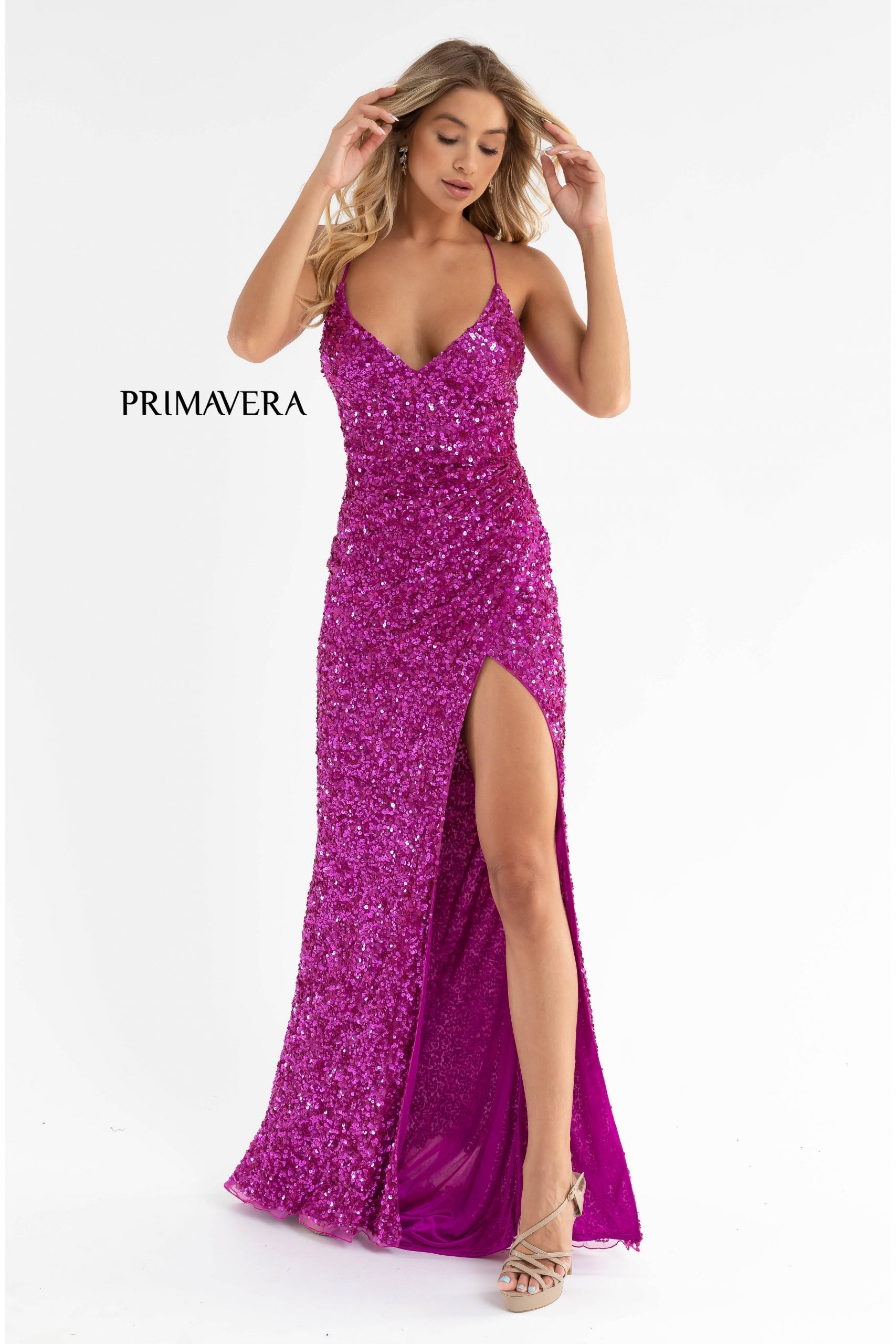 Primavera Couture 3791 Exclusive Prom Dress.  This is an all sequins prom dress with a V neckline and spaghetti straps that lace up and tie in the open back.  It has a wrap style side slit and a sweeping train.  Colors:  Fuchsia  Sizes:  4