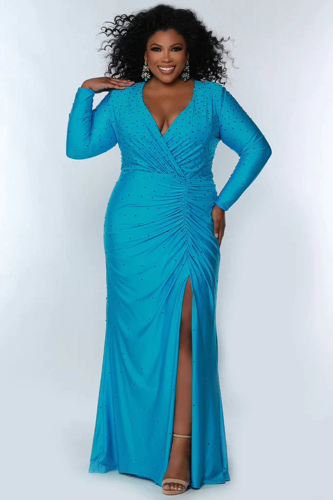 ydney's Closet SC7345 Long Sleeve Fitted Plus Size Prom Dress Slit Formal Gown V Neck Heat Stone ruched evening wear  Colors: Blue Attitude, Hot Pink, Screamin' Green Size: 14-32 Stretch lycra with hot fix stones Fitted silohuette Deep V-neckline Long sleeves High back Natural waistline with ruching Slit