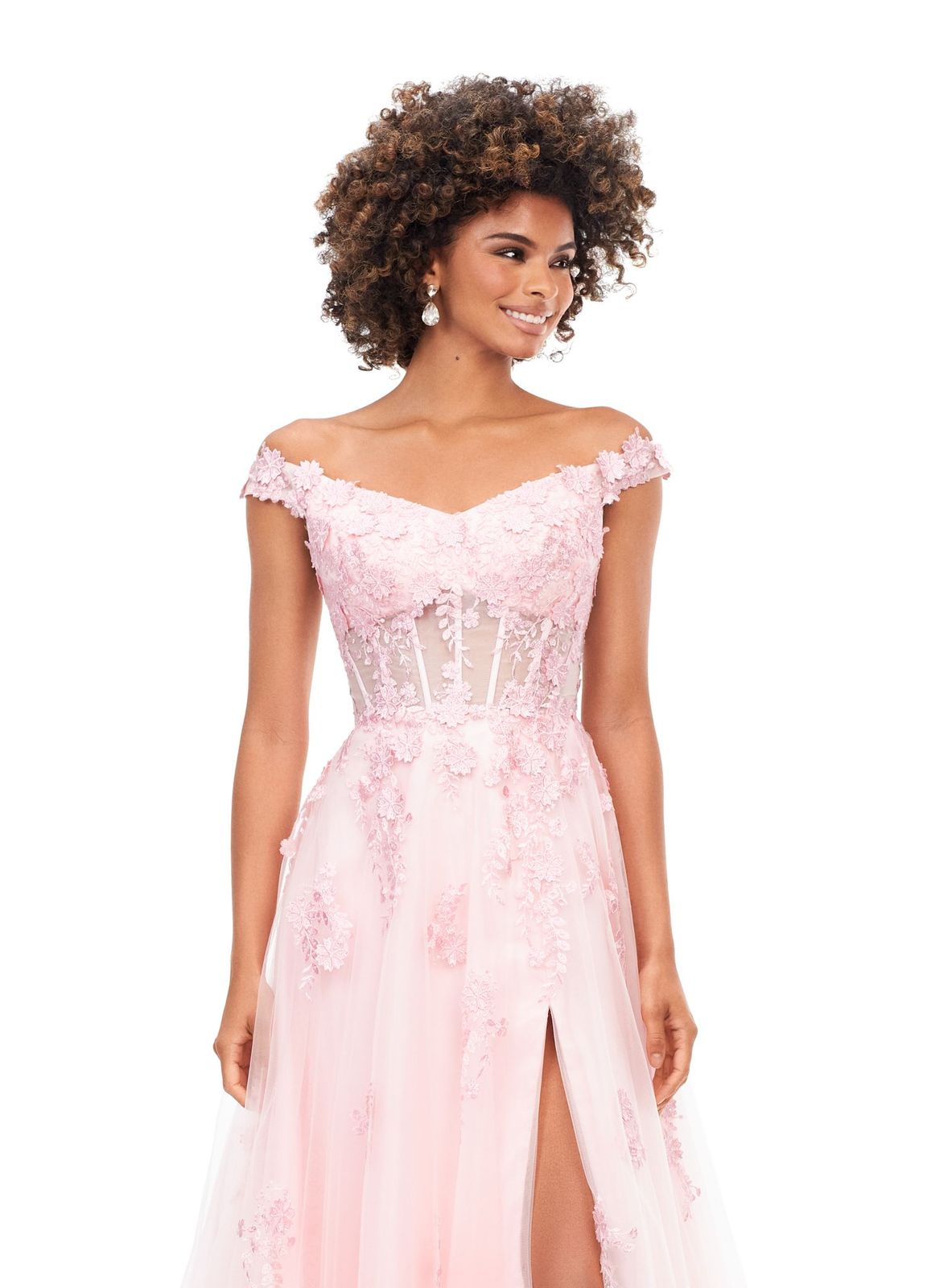 Ashley Lauren 11376 This off the shoulder fairytail dream gown features an illusion corset and 3-dimensional lace flower appliques throughout layers of tulle. The look is complete with a left leg slit. Off Shoulder Neckline Illusion Bodice 3-Dimensional Lace Flower Appliques Tulle Black, Pink